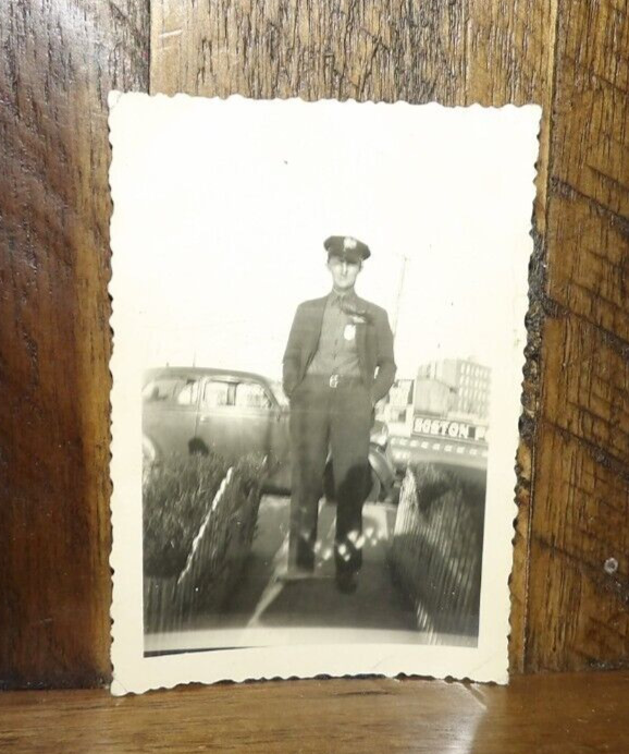 Sale is for a Circa 1950's Snapshot-Boston Policeman with Boston Police Sign