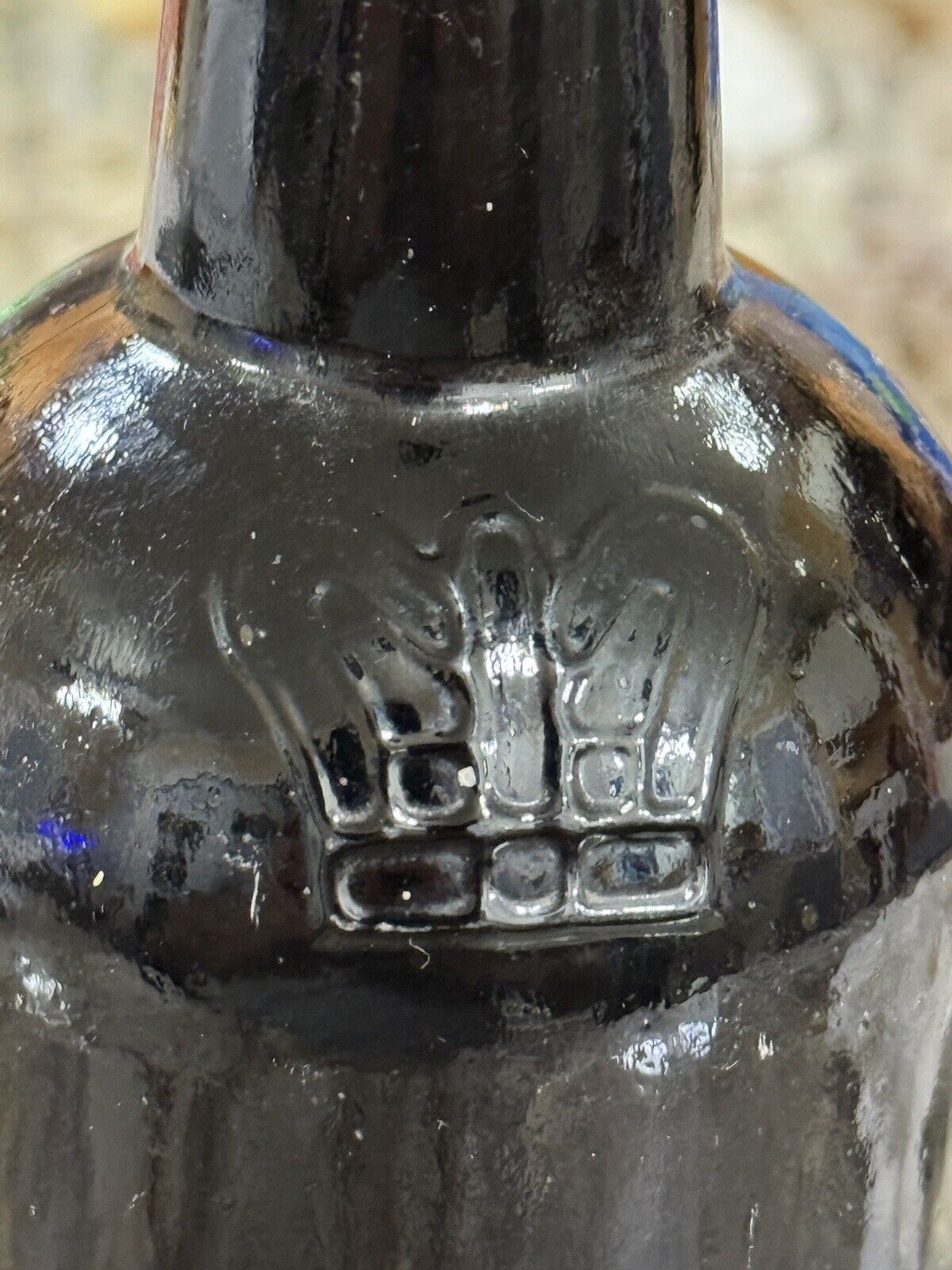 vintage black blob top bottle with embossed Crown on the bottle 