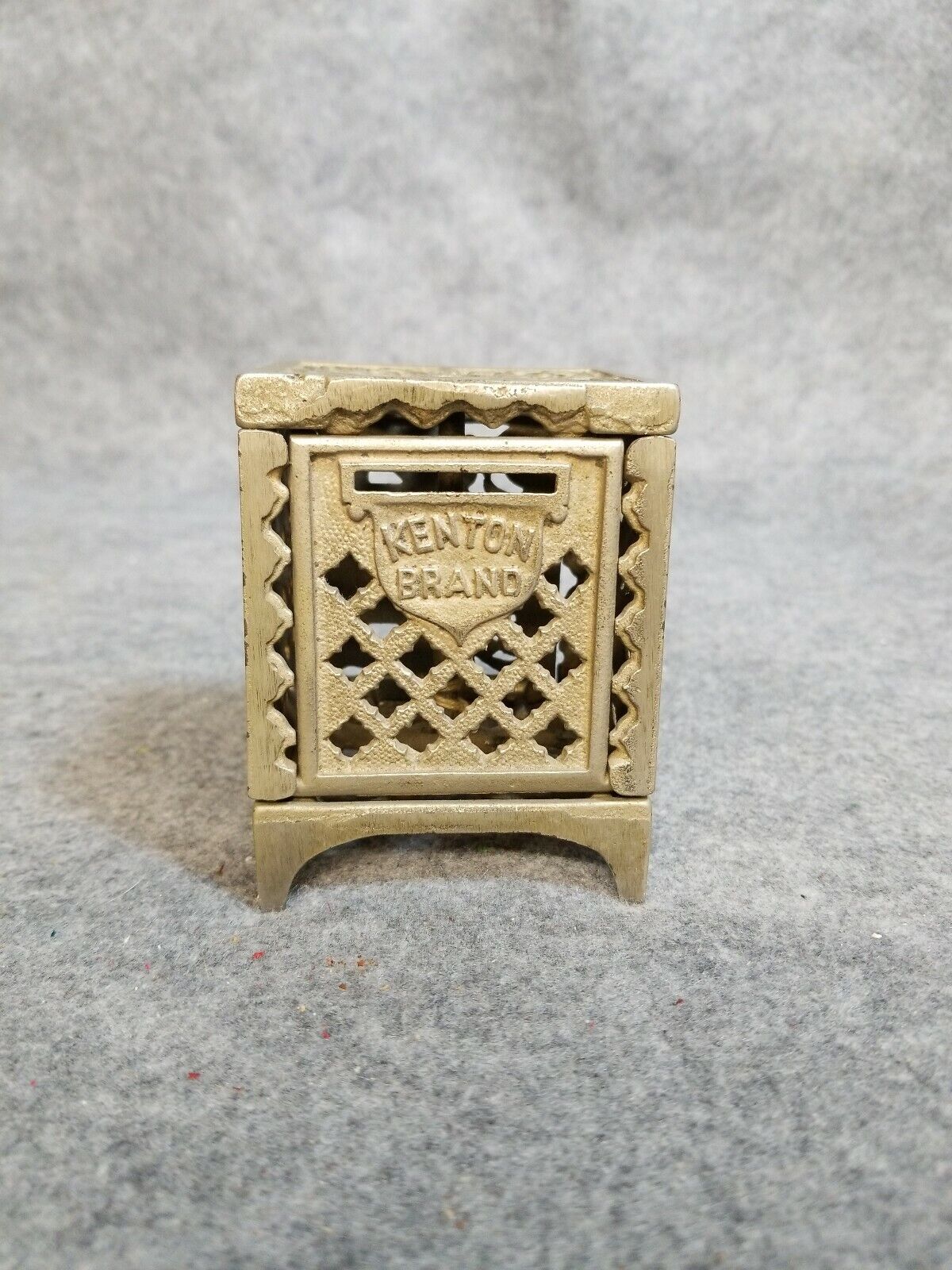 Kenton Brand Metal Penny Bank, little over 3 1/2 inches tall.