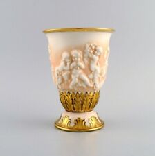 Capodimonte, Italy. Antique porcelain vase with putti in relief. picture