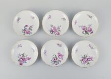 Six antique Meissen plates, hand painted with polychrome flowers and gold edge. picture