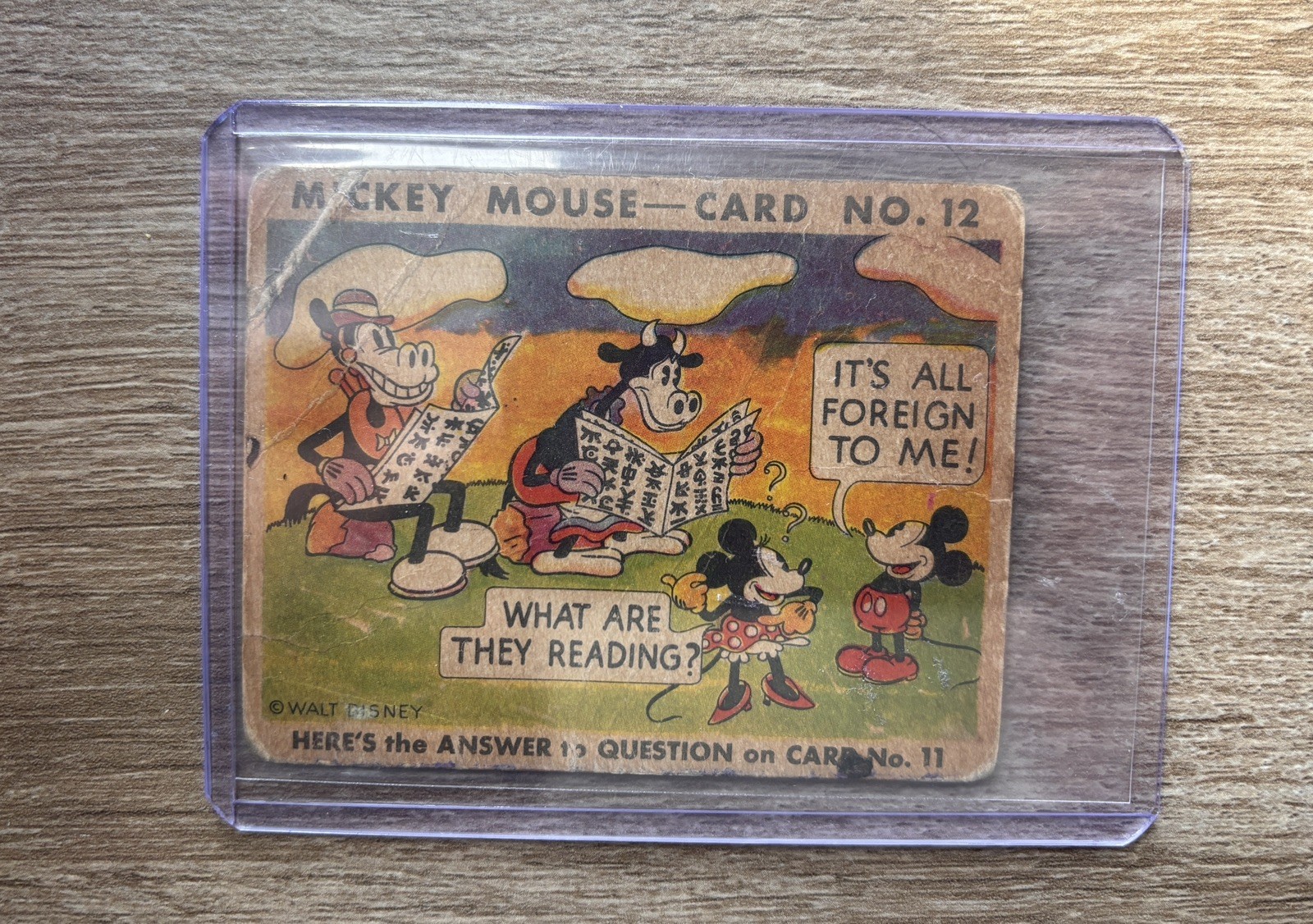 1935 Mickey Mouse Gum Card #12 What Are They Reading? It's All Foreign to Me 1935 Mickey Mouse Gum Card #12 What Are They Reading? It's All Foreign to Me