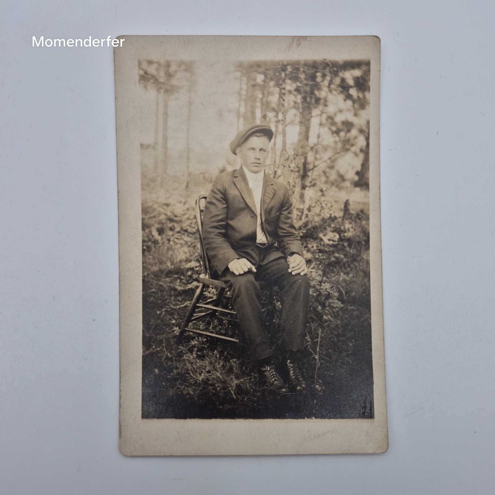 Antique RPPC Young Man Flat Cap Seated Outdoors NOKO Real Photo Postcard 1910s