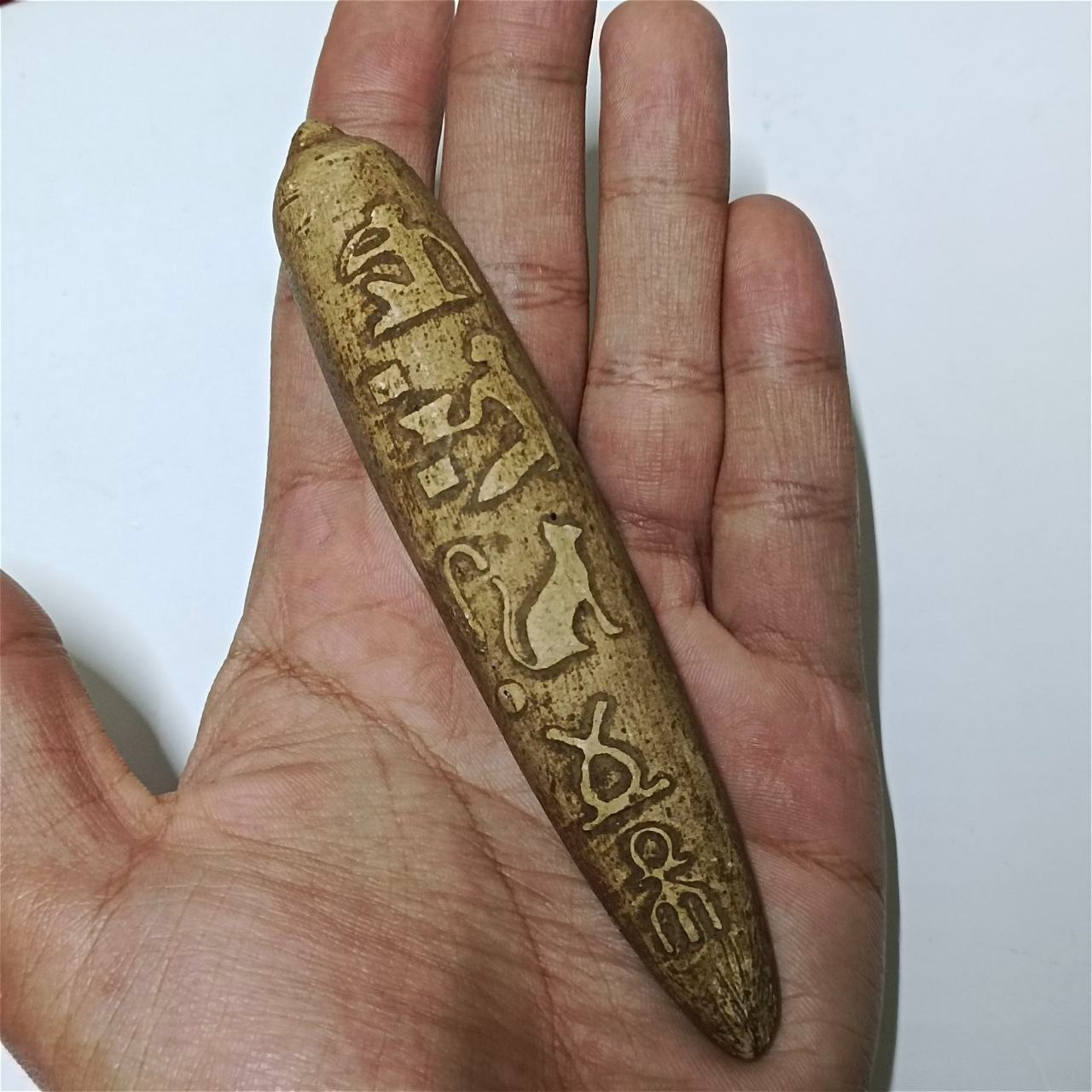 Hand-carved Egypt inspired piece with ancient style symbols cultural collectible