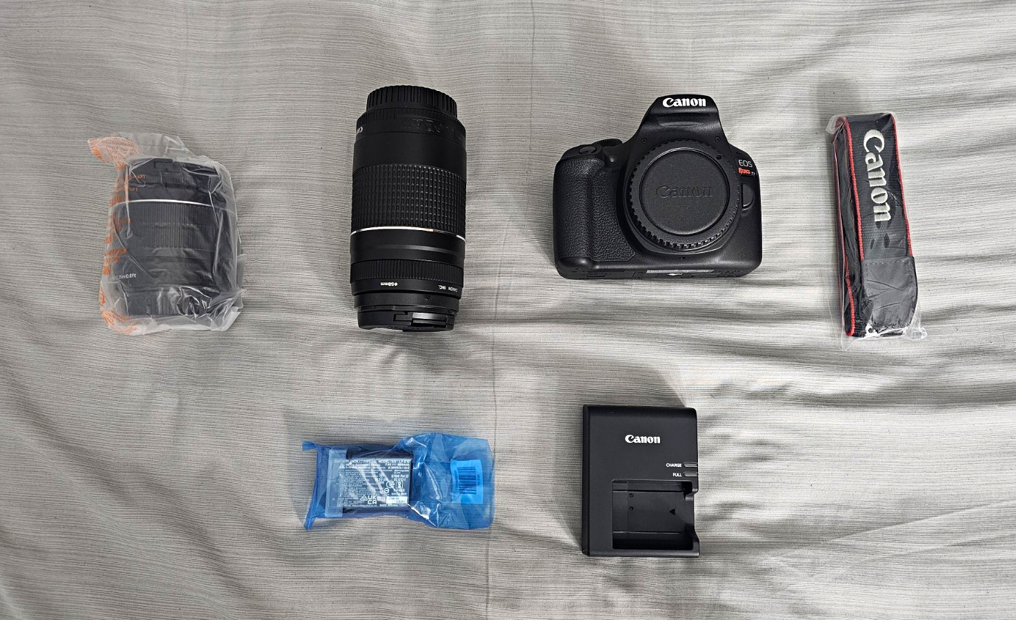 Canon EOS Camera Rebel T7 Body w/ Canon Zoom Lens Battery, Charger never used Canon EOS Camera Rebel T7 Body w/ Canon Zoom Lens Battery, Charger never used