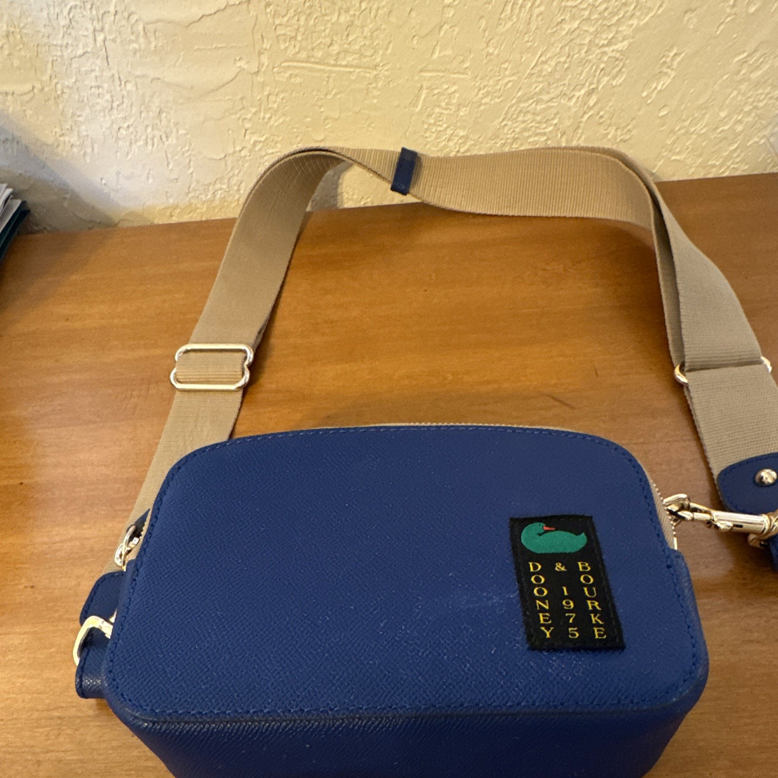 Dooney & Bourke Blue Pebbled Leather Zip Crossbody, Beige Canvas Strap, Small Dooney & Bourke Blue Pebbled Leather Zip Crossbody, Beige Canvas Strap, Small
