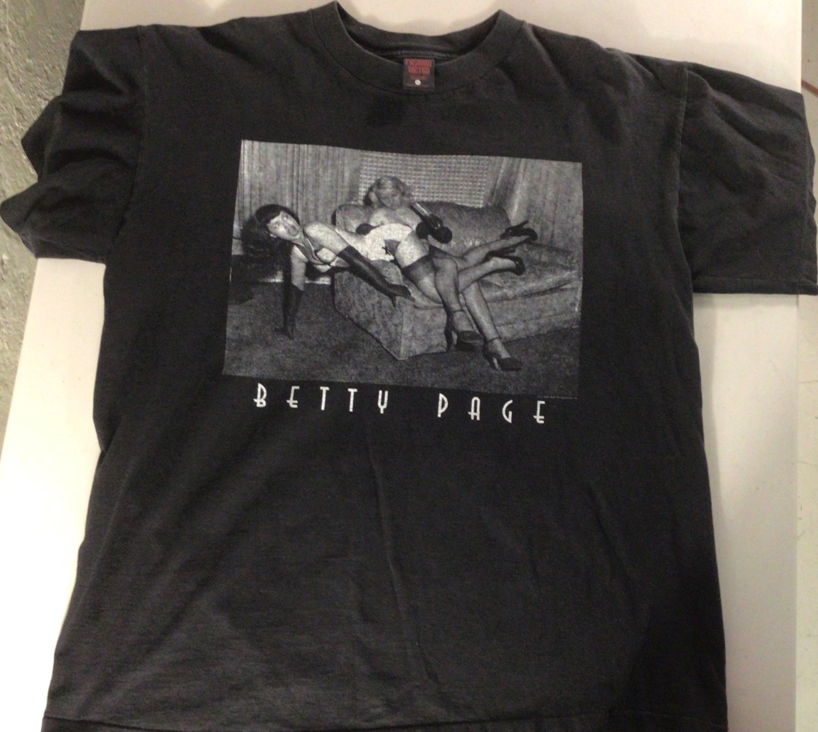 Vintage 1997 Betty Page Fashion Victim Heavyweight Faded T-Shirt - XL Vintage 1997 Betty Page Fashion Victim Heavyweight Faded T-Shirt - XL
