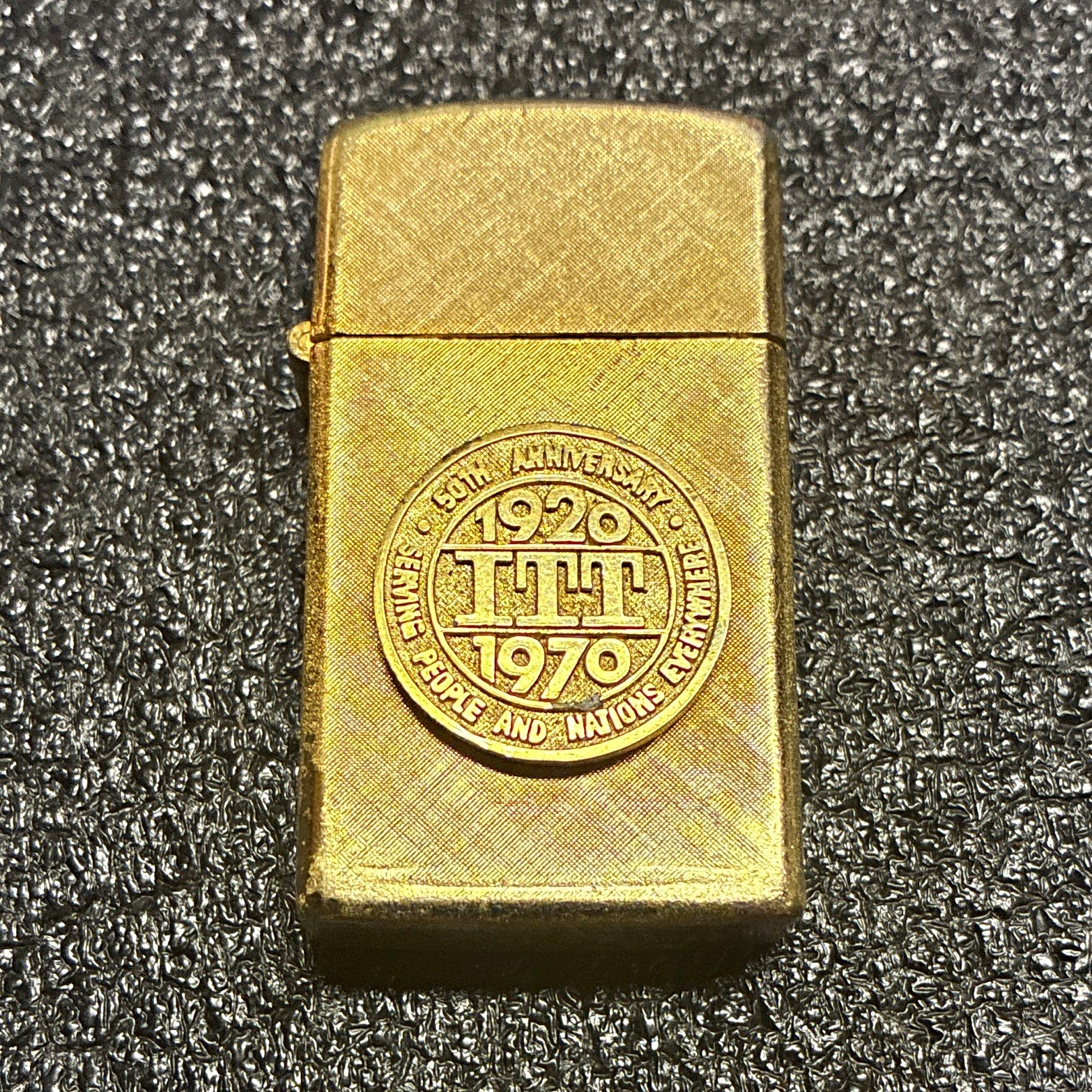 Zippo Brass-Tone Flip-Top Lighter w/ 1920-1970 50th Anniversary Emblem