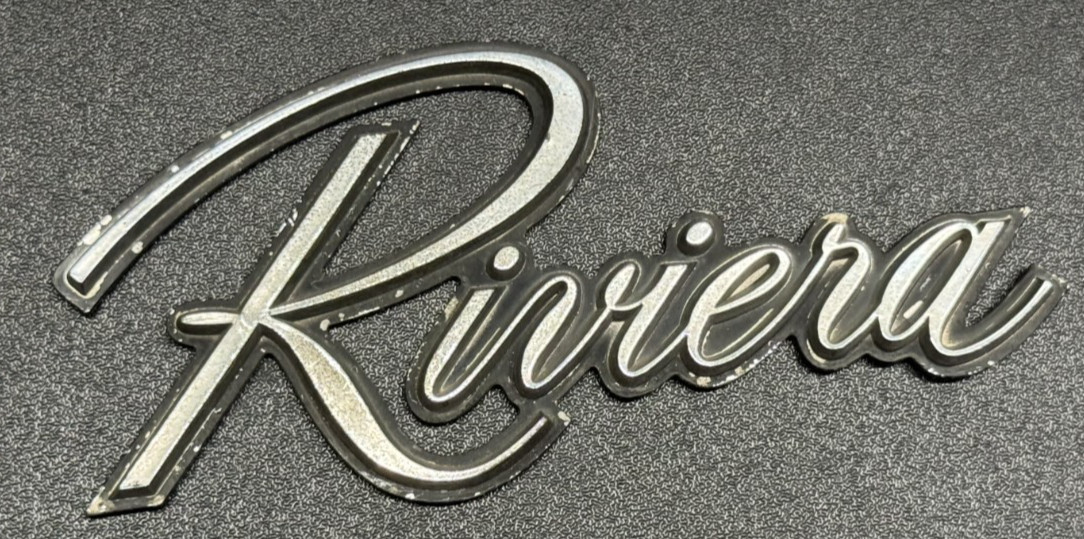 1979-1985 Buick Riviera Chrome Monogram Script Emblem OEM #1261160 5inx2in