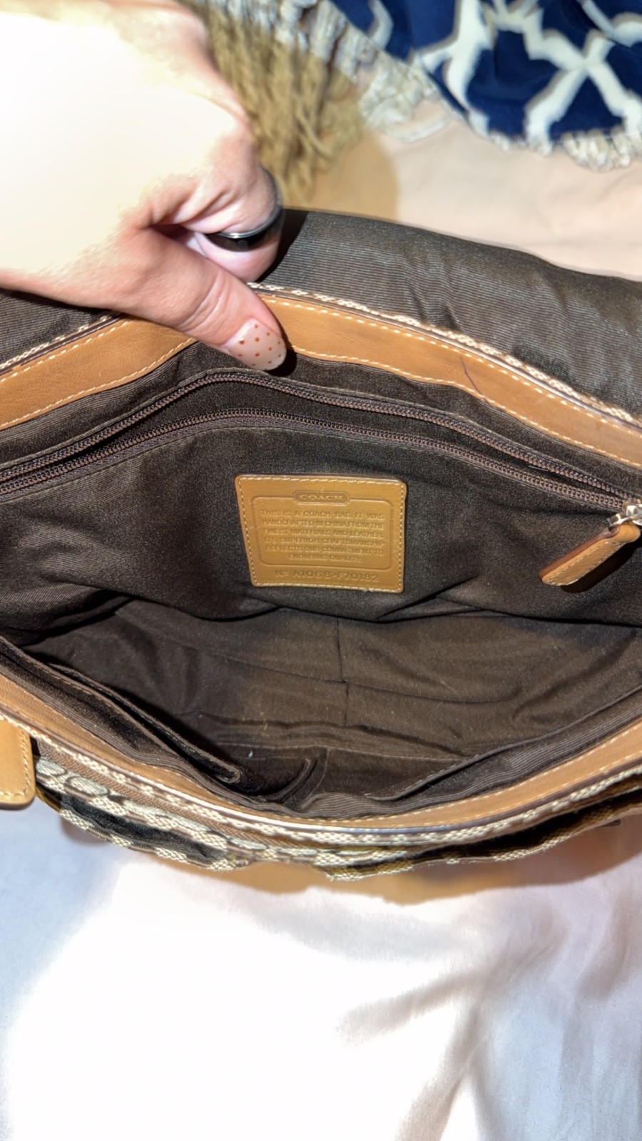 vintage coach purse/satchel has one spot rest is perfect. Brown tan and white. vintage coach purse/satchel has one spot rest is perfect. Brown tan and white.