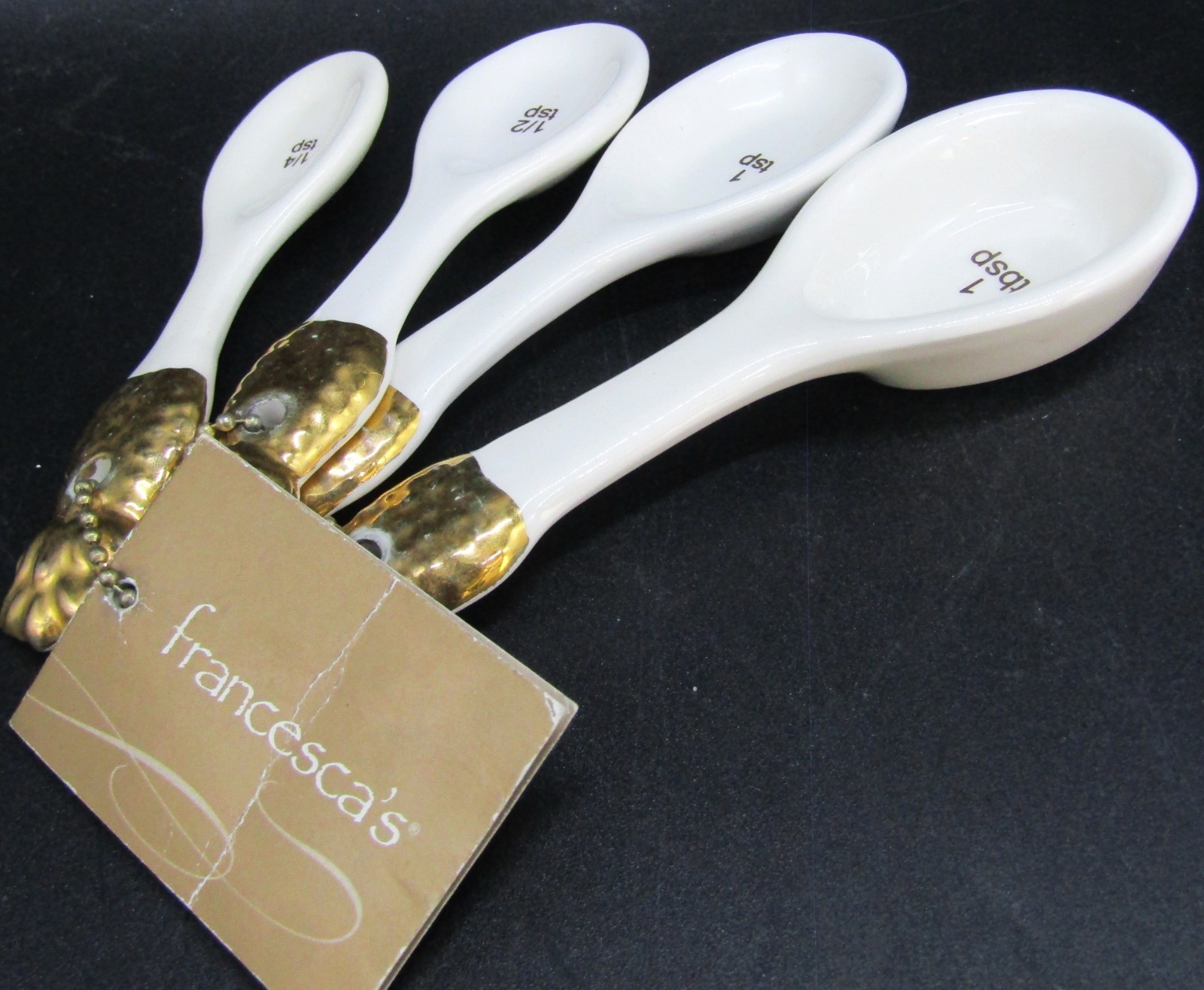 Francesca\'s White and Gold Porcelain Measuring Spoons. Francesca\'s White and Gold Porcelain Measuring Spoons.