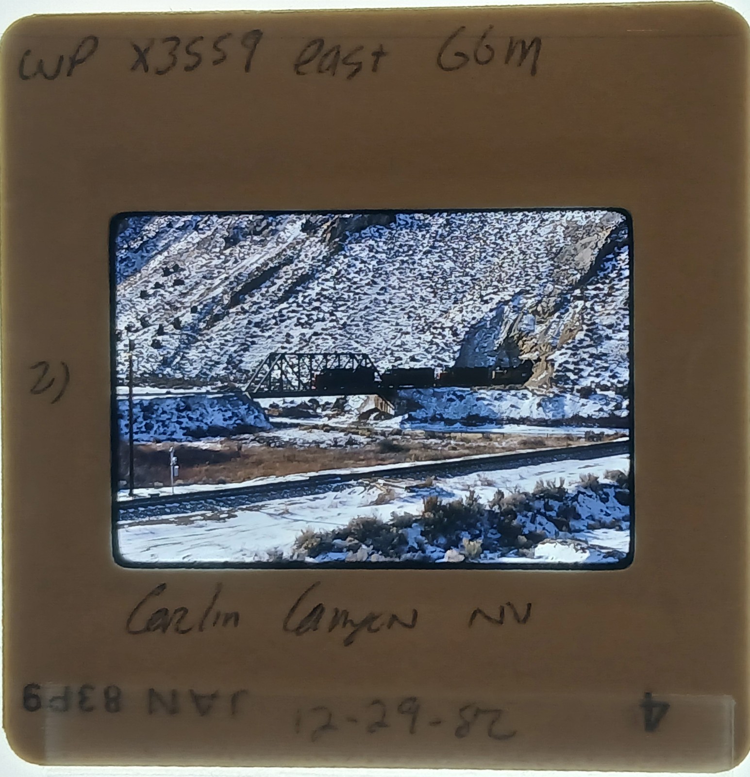 Orig Slide WP Western Pacific GP35 3559 East +train Carlin Canyon NV 29Dec1982 Orig Slide WP Western Pacific GP35 3559 East +train Carlin Canyon NV 29Dec1982