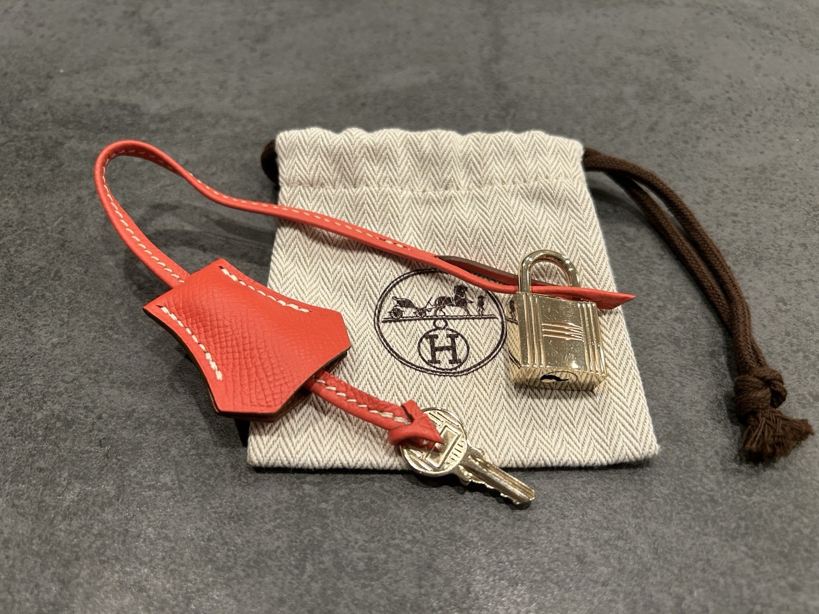 Hermes Gold Cadena Lock 114 w/Key Red Clochette Dust Bag Authentic Hermes Gold Cadena Lock 114 w/Key Red Clochette Dust Bag Authentic