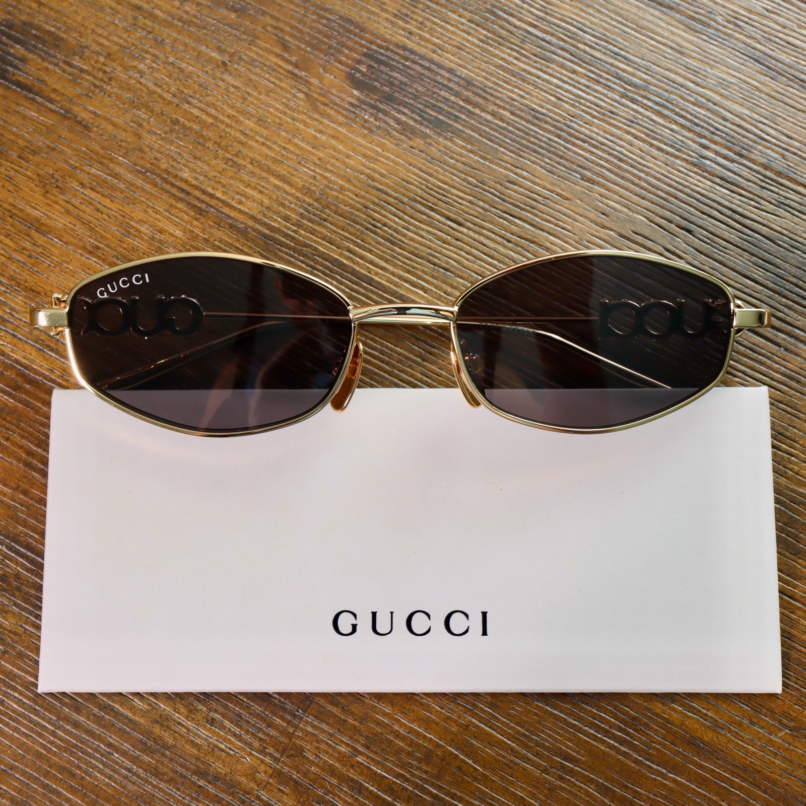 Gucci GG1802S 001 55mm Square Sunglasses in Gold/Gray Lens Crystal Arm Logo
