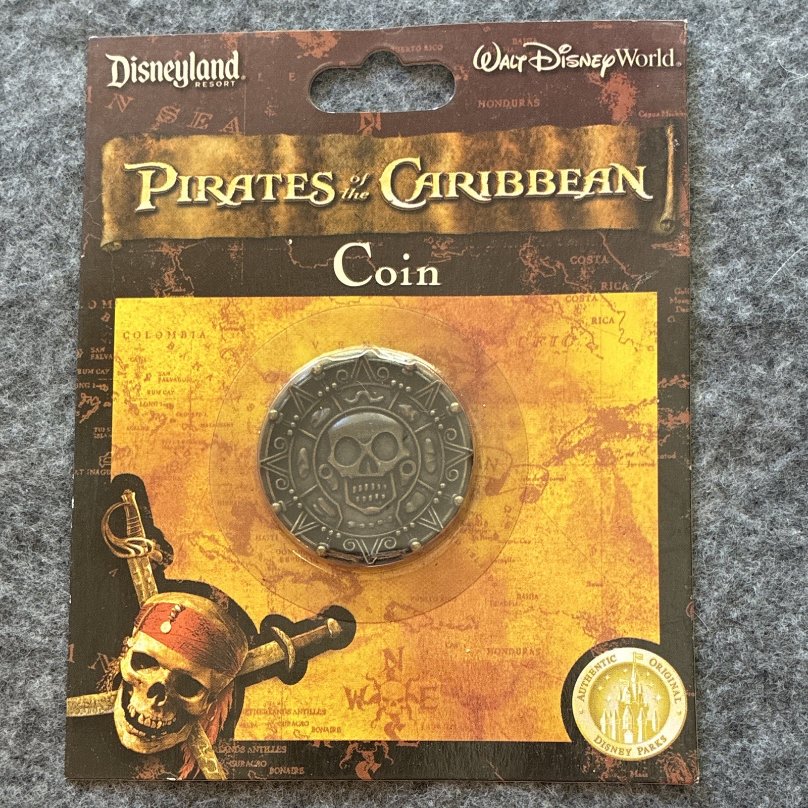 Disney Parks Pirates of the Caribbean Coin Skull Emblem - Disney Franchise Disney Parks Pirates of the Caribbean Coin Skull Emblem - Disney Franchise