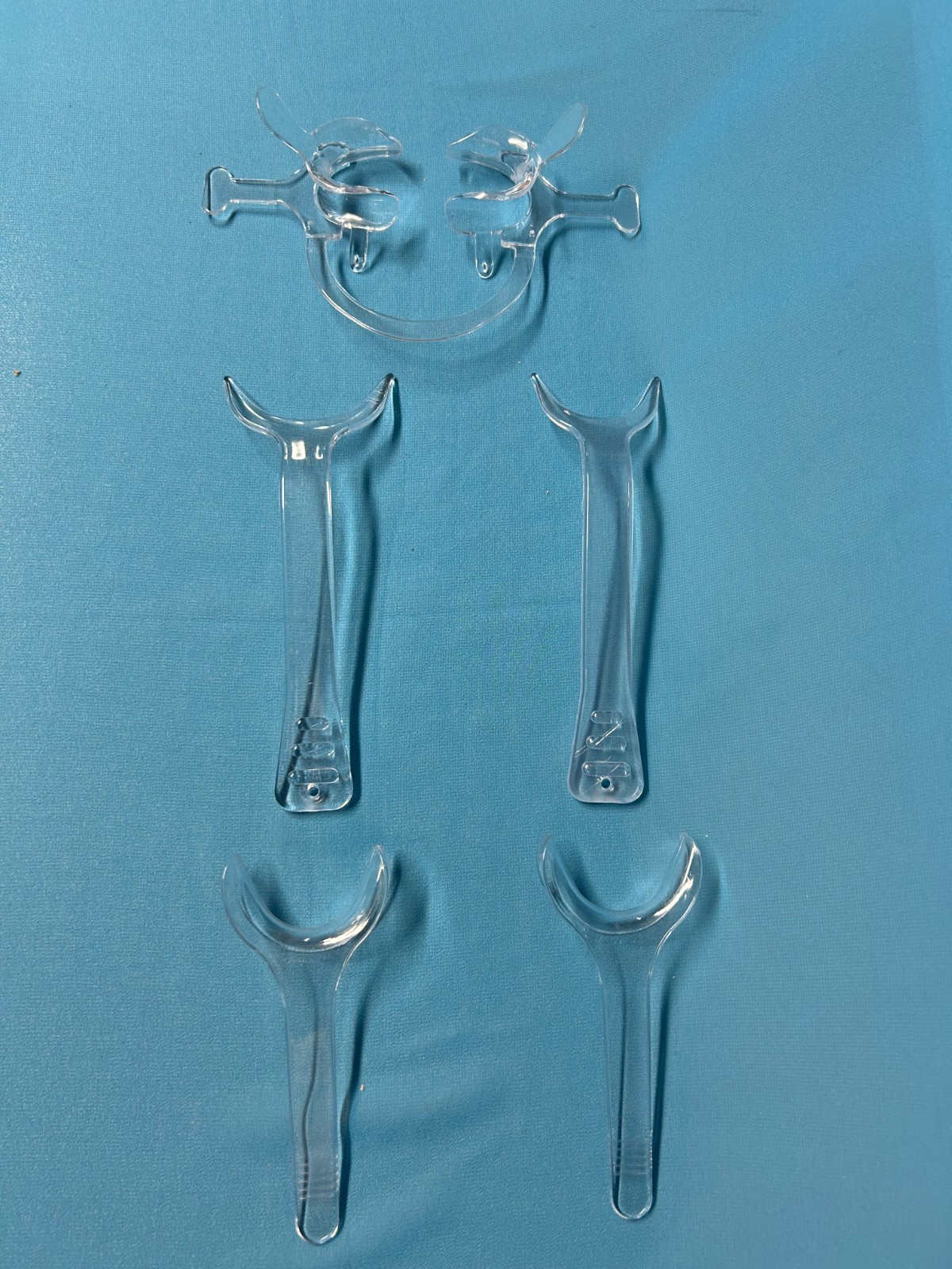5 different clear, immaculate cheek retractors for photography & procedures. 5 different clear, immaculate cheek retractors for photography & procedures.