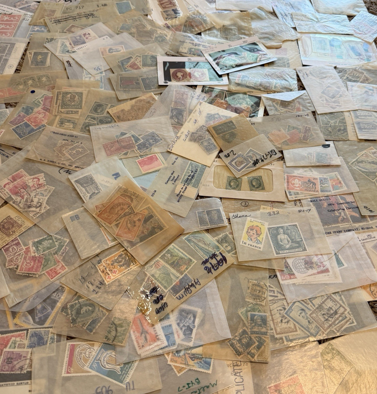 MASSIVE MIXTURE OF WORLDWIDE ESTATE MINT USED OVERPRINT STAMPS IN GLASSINES LOT MASSIVE MIXTURE OF WORLDWIDE ESTATE MINT USED OVERPRINT STAMPS IN GLASSINES LOT
