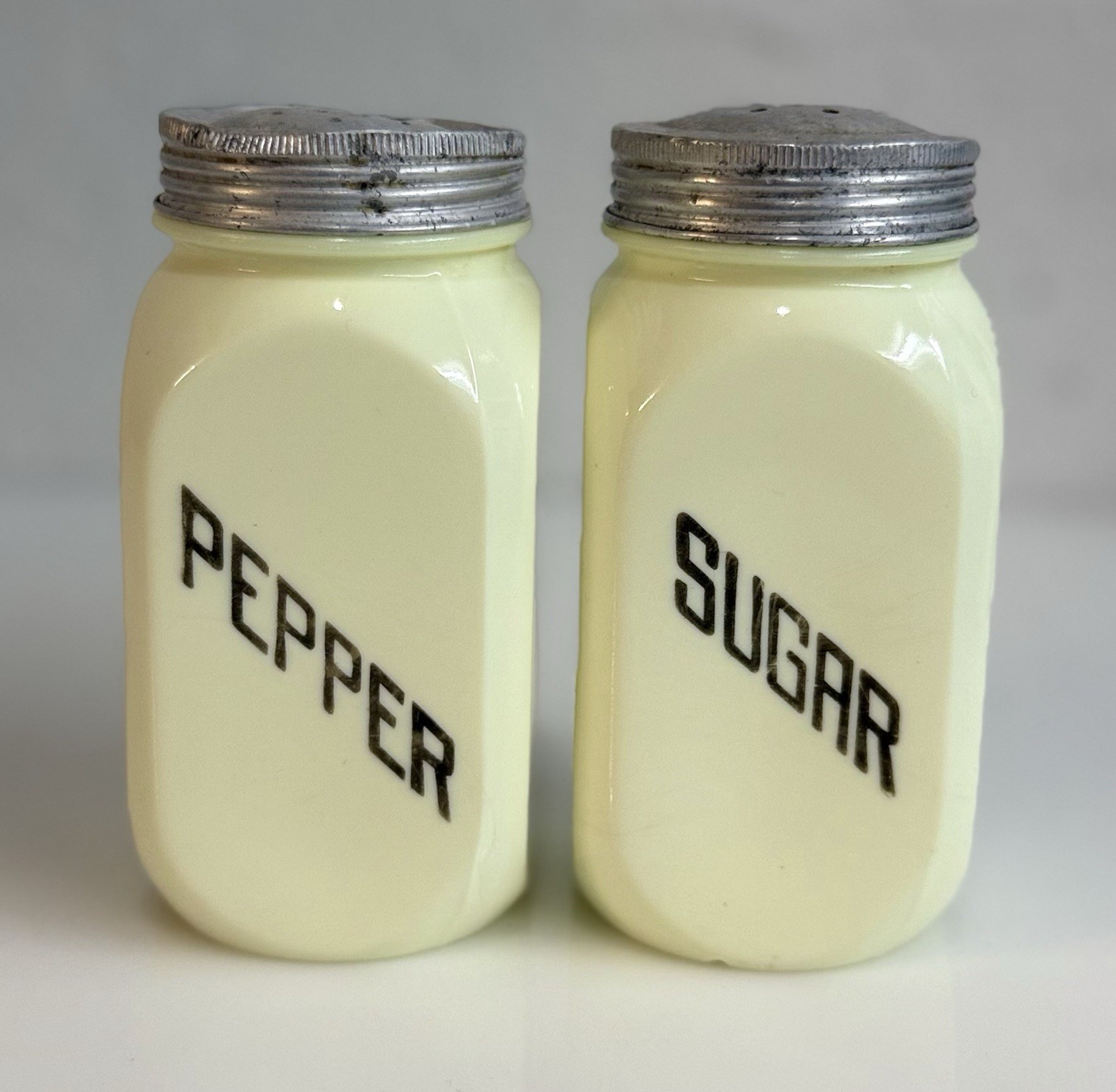 1930s McKee Custard Glass Pepper & Sugar Shakers W/ Lids, Uranium Glows Green