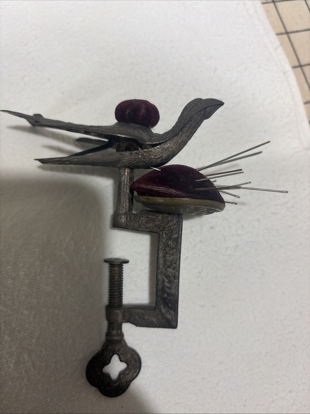 Antique Victorian Bird sewing pin cusion with clamp pin with detail on brass