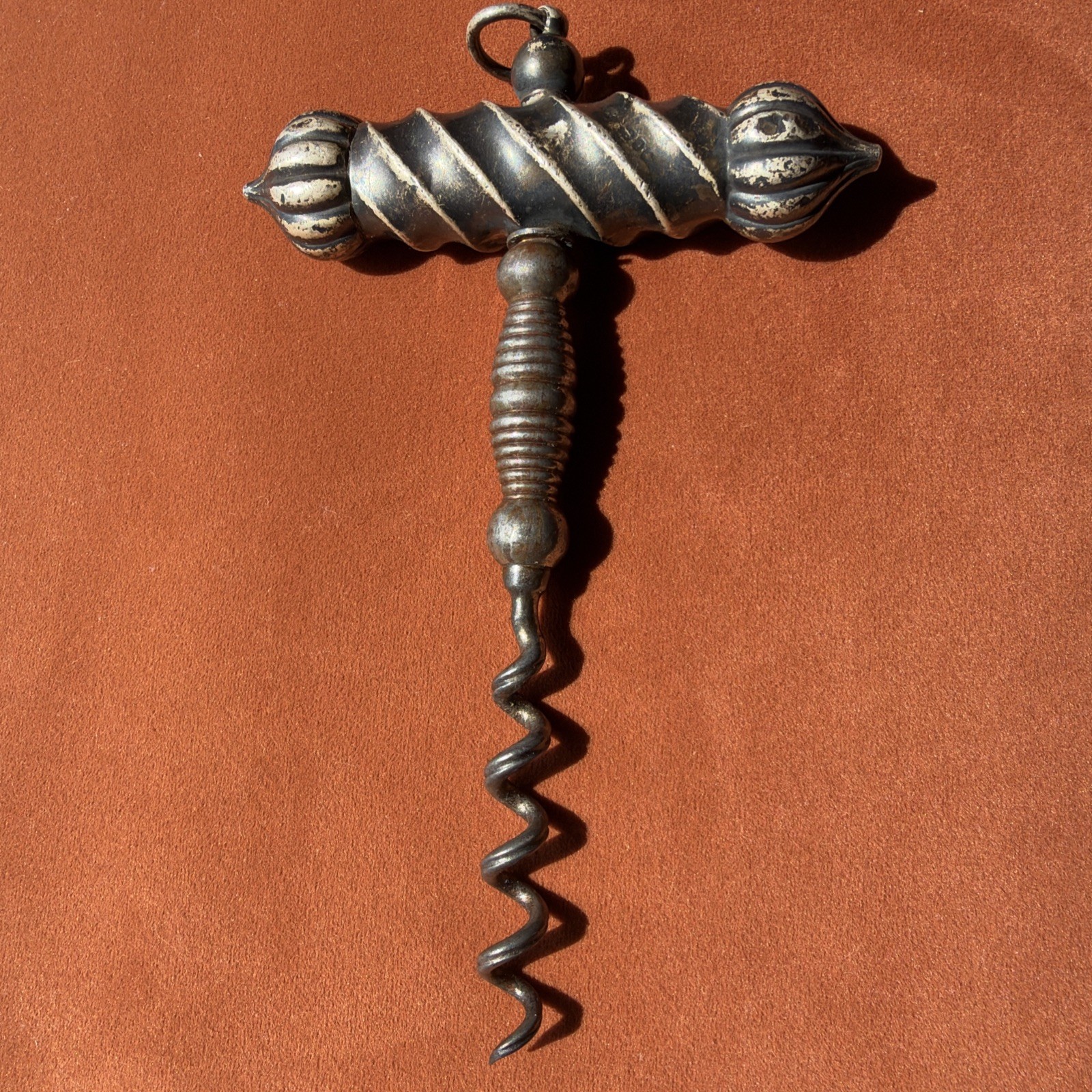 A rare antique Victorian-era silver corkscrew—or a 20th-century perspective.