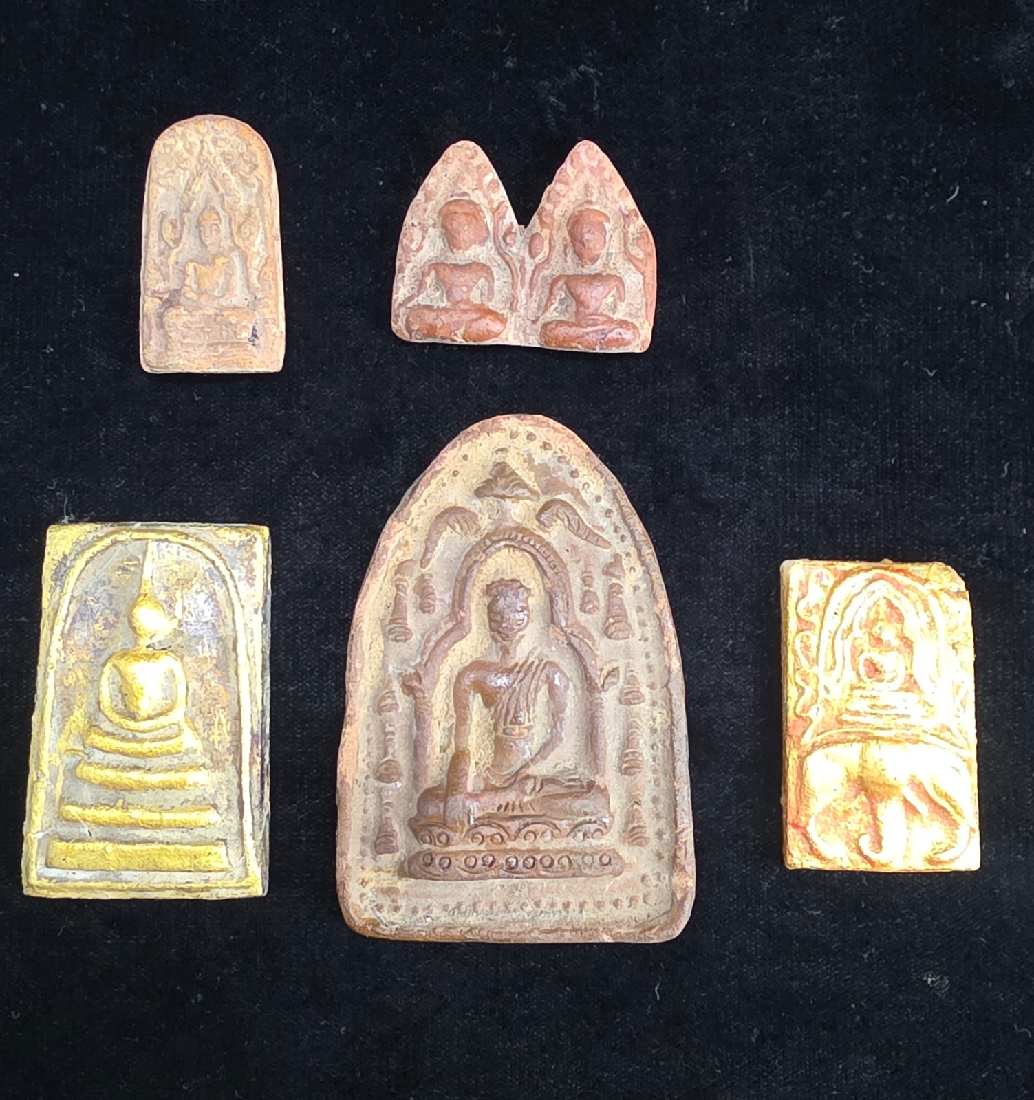 A collection of Buddhist Amulets Thailand Burma monastery gold leaf Elephant art