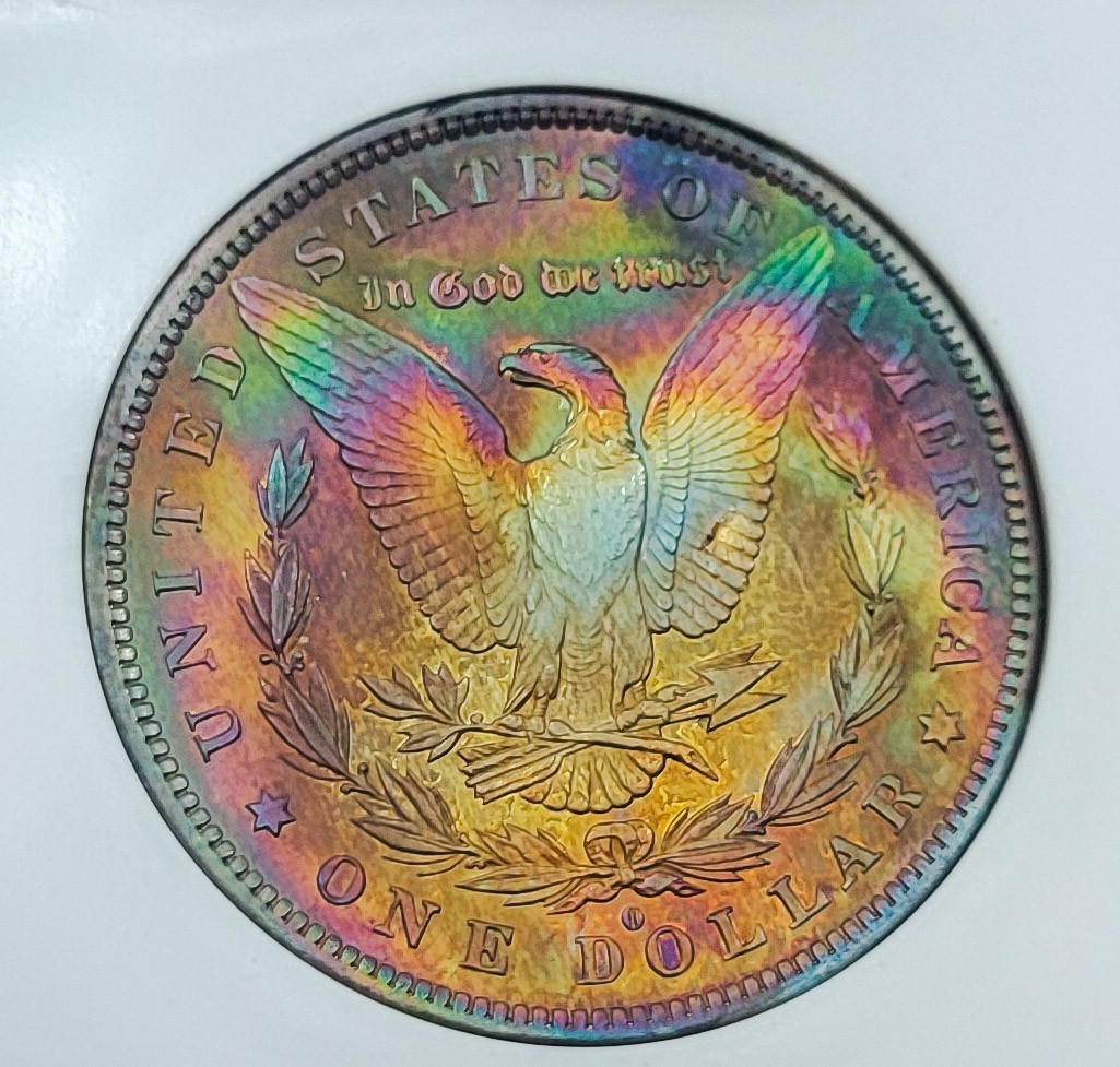 1884 O Morgan Silver Dollar Under graded MS60 by PCI / Rev Rainbow/ Obv PL. 1884 O Morgan Silver Dollar Under graded MS60 by PCI / Rev Rainbow/ Obv PL.