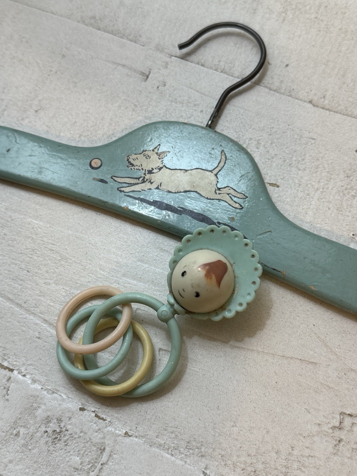 vintage 1930s to 1940s Art Deco wooden child's clothes hanger and baby rattle