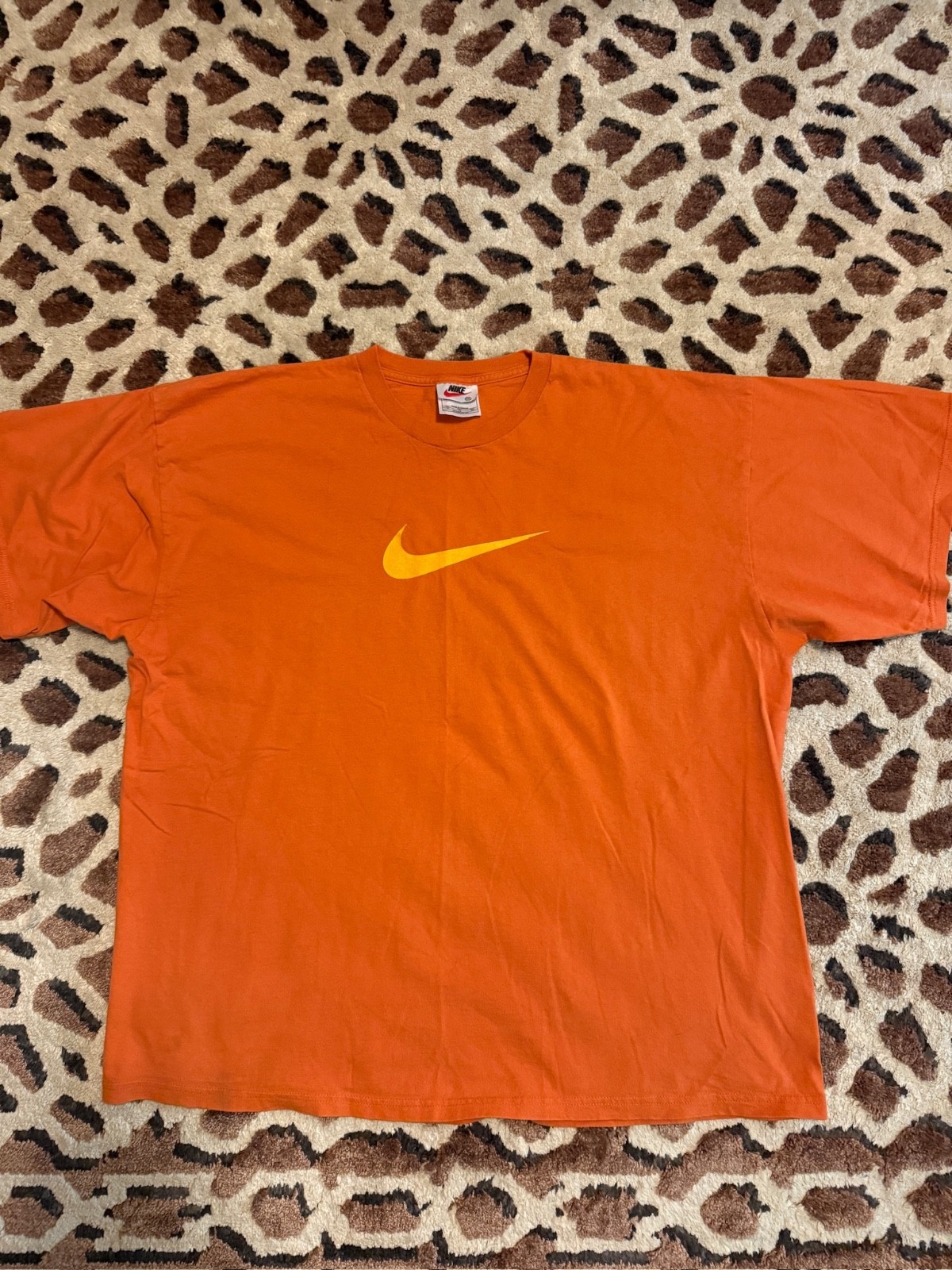 Orange Vintage Nike tee with yellow swoosh nike