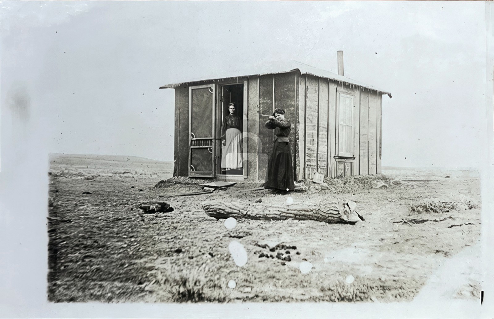 Pioneer shack in old west woman w rifle 1910 RPPC Photo Postcard COPY