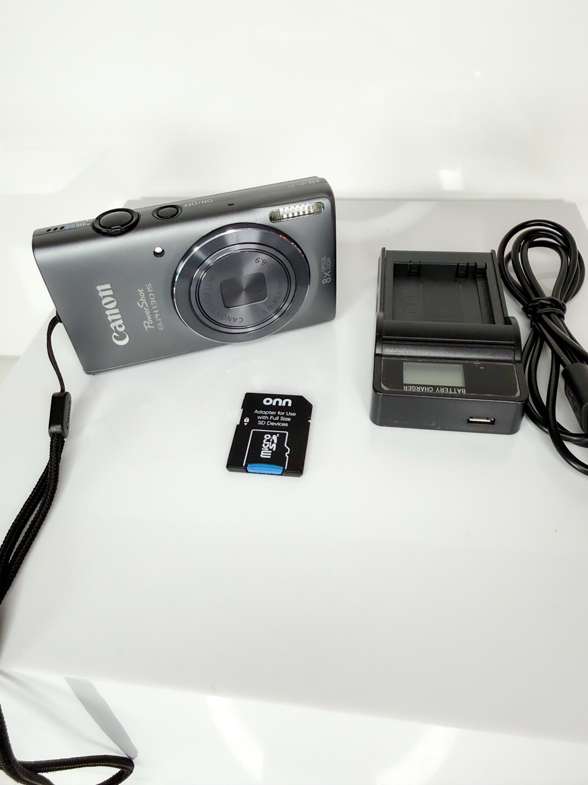 Canon PowerShot ELPH 130 IS Digital Camera - Silver Includes Battery Charger SD