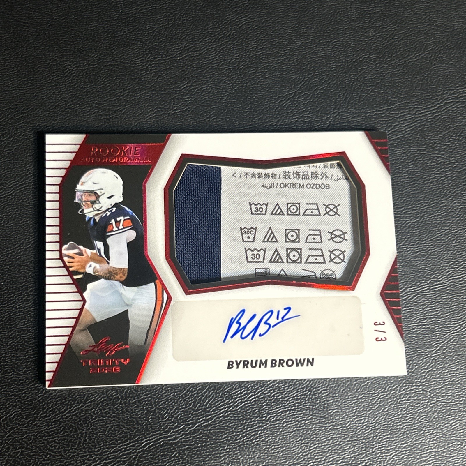 2026 Leaf Trinity Byrum Brown Red Patch Auto 3/3 Laundry Tag Auburn Tigers 2026 Leaf Trinity Byrum Brown Red Patch Auto 3/3 Laundry Tag Auburn Tigers