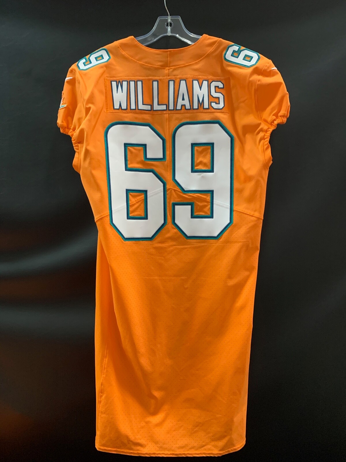 #69 JORDAN WILLIAMS MIAMI DOLPHINS USED TEAM ISSUED ORANGE COLOR RUSH JERSEY #69 JORDAN WILLIAMS MIAMI DOLPHINS USED TEAM ISSUED ORANGE COLOR RUSH JERSEY