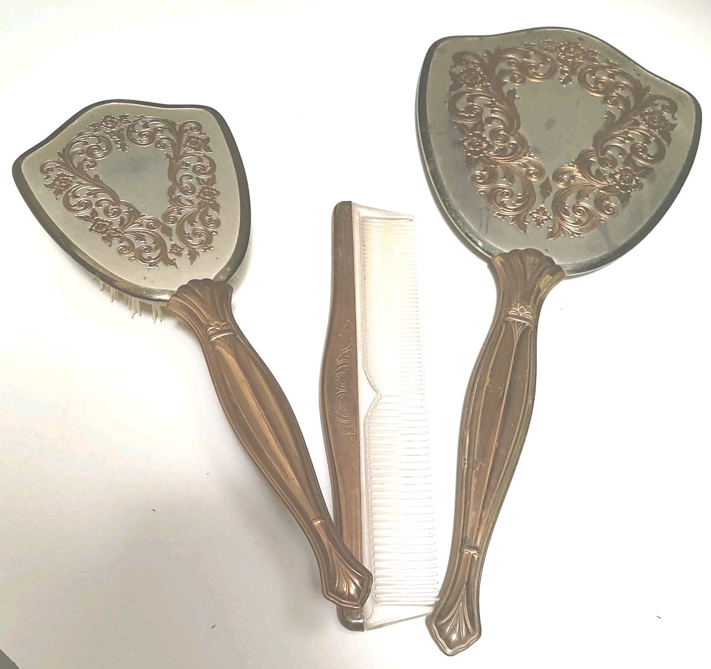 Vintage Vanity Set-Hand Mirror, Hair Brush and Comb Gold plate trim and handle. Vintage Vanity Set-Hand Mirror, Hair Brush and Comb Gold plate trim and handle.