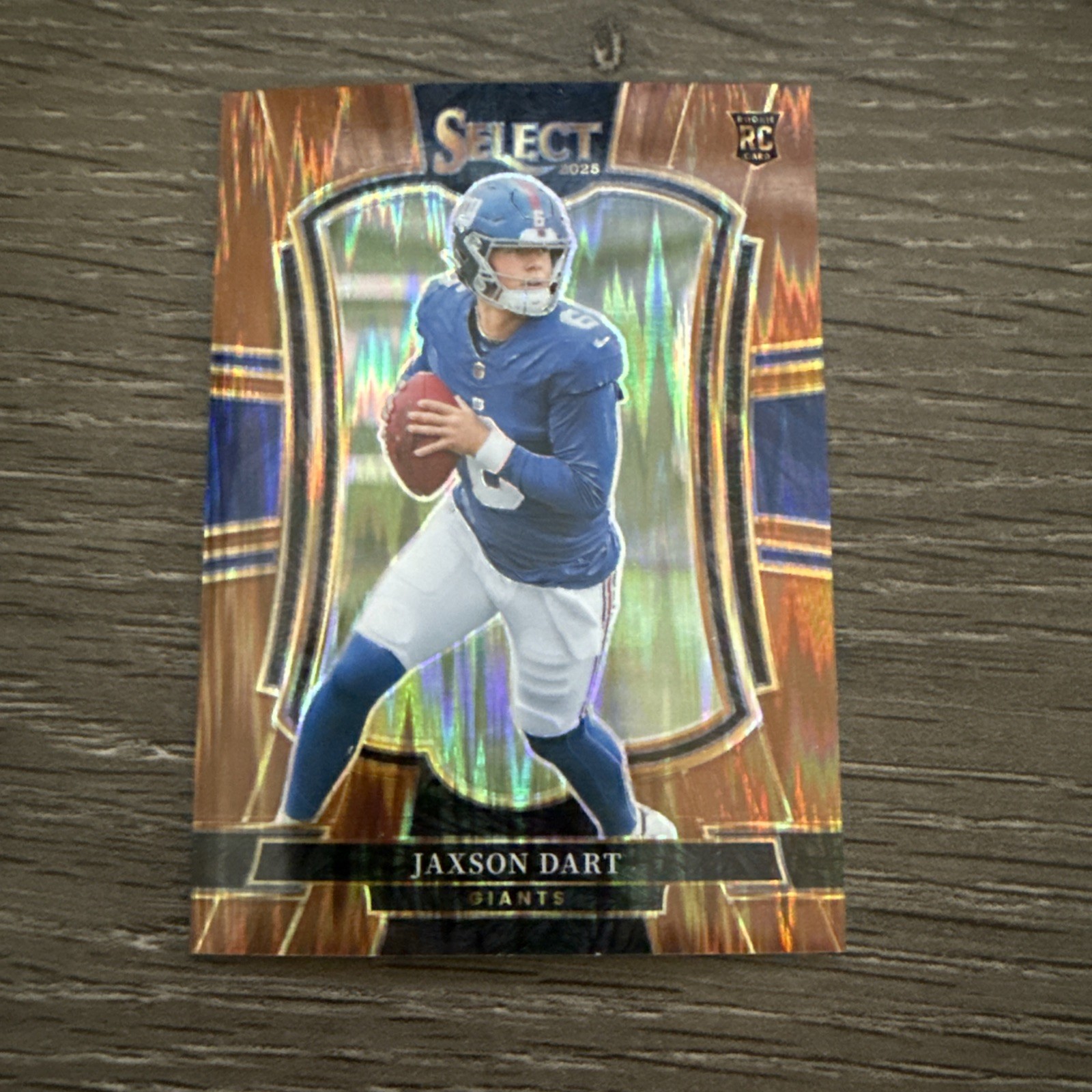 2025 Panini Select - Premier Level Jaxson Dart #193 Copper Shock Prizm /899 (RC) 2025 Panini Select - Premier Level Jaxson Dart #193 Copper Shock Prizm /899 (RC)