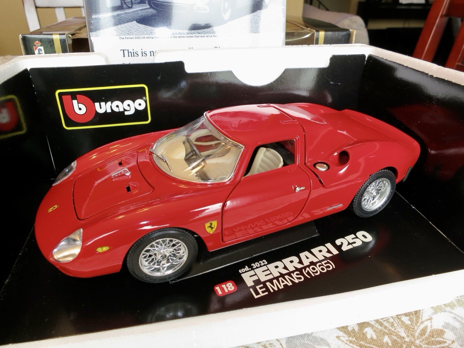 Burago 1:18 Ferrari 250 LM 1965 Red Diecast Shell Series. Comes with 6x10 sign