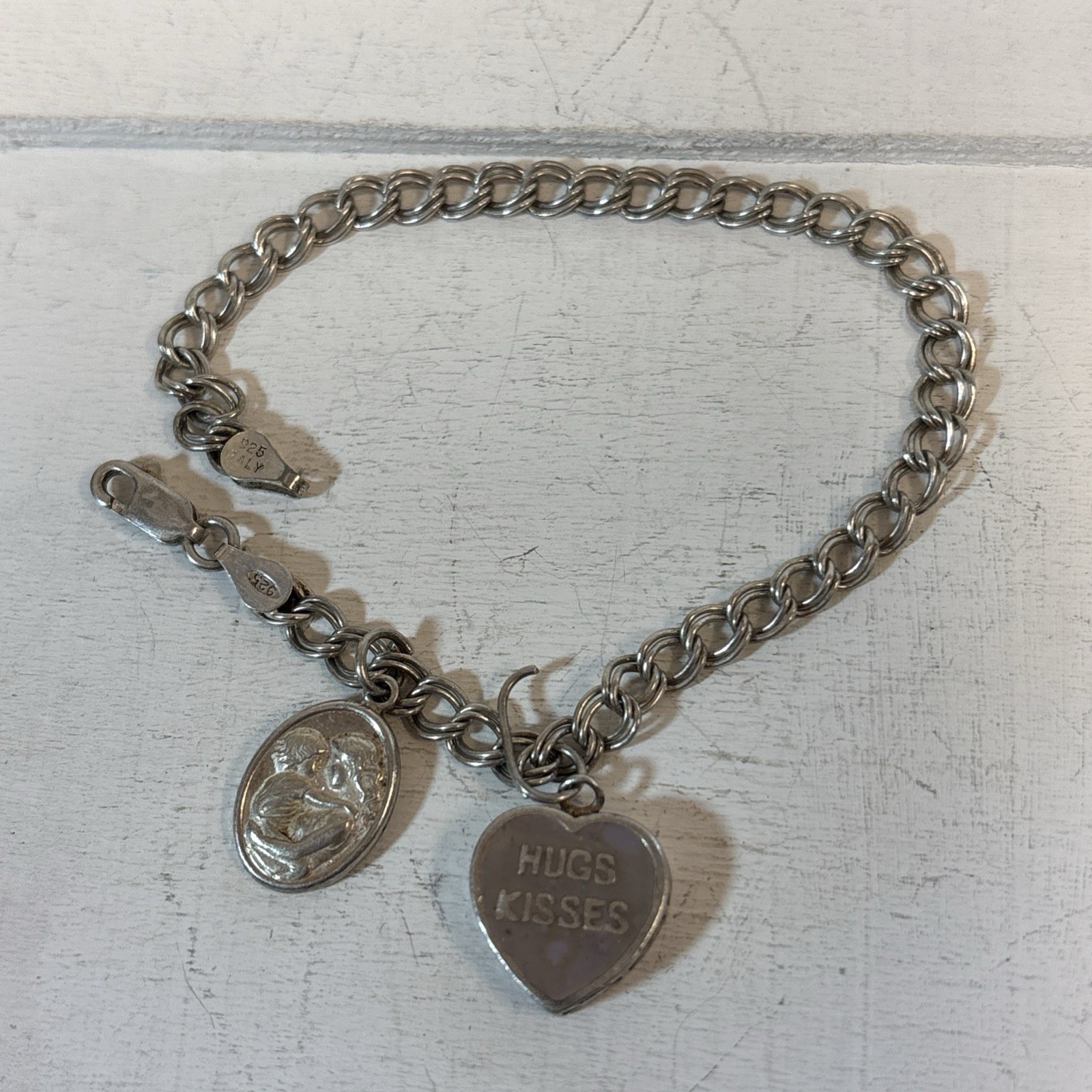 vintage 925 charm bracelet with sterling silver charms 7.82g 6.5” Long Heart vintage 925 charm bracelet with sterling silver charms 7.82g 6.5” Long Heart