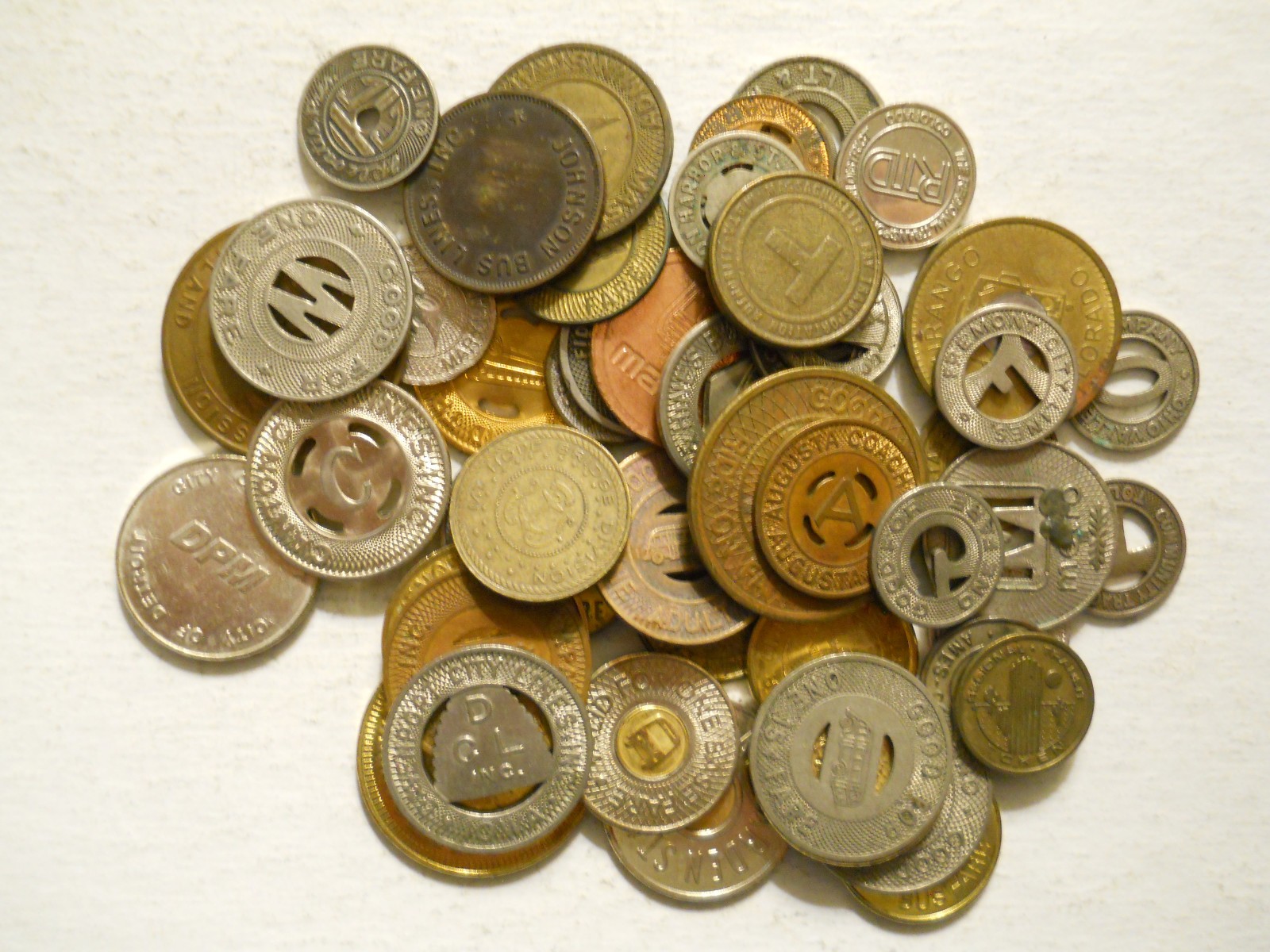 Lot of 50 different transit tokens - read description