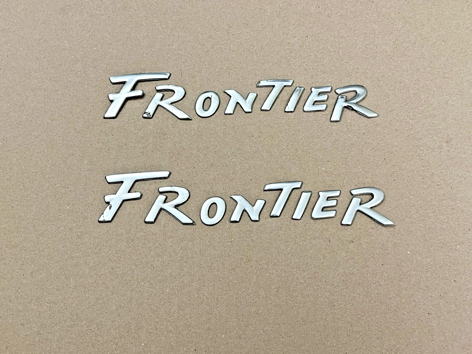 1998-2001 NISSAN FRONTIER DOOR EMBLEM USED OEM 1998-2001 NISSAN FRONTIER DOOR EMBLEM USED OEM