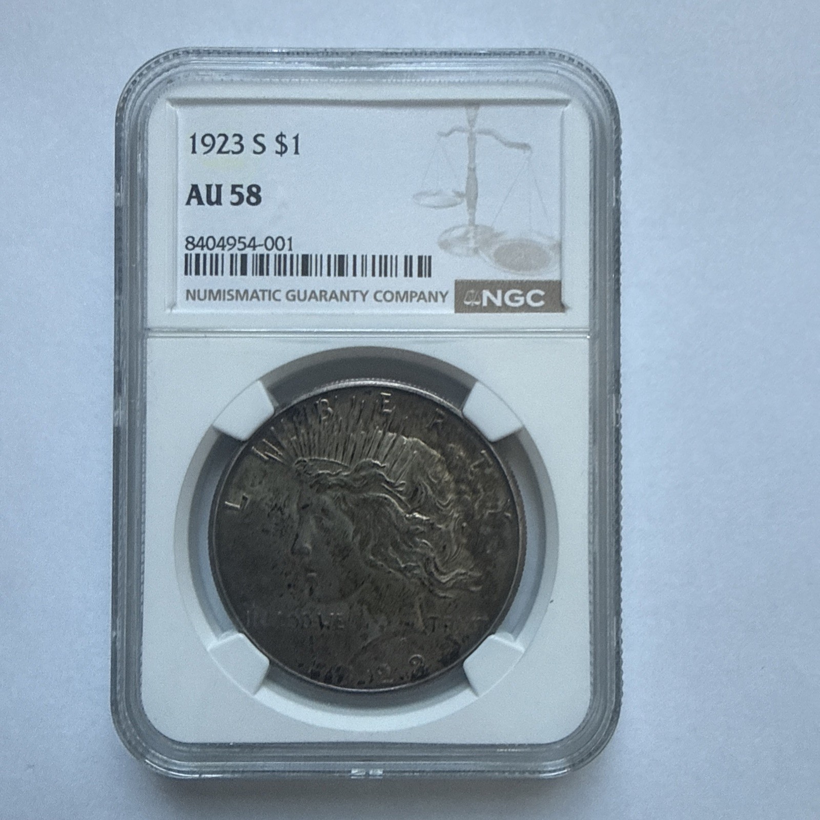 1923-S Peace Silver Dollar NGC AU58. 1923-S Peace Silver Dollar NGC AU58.