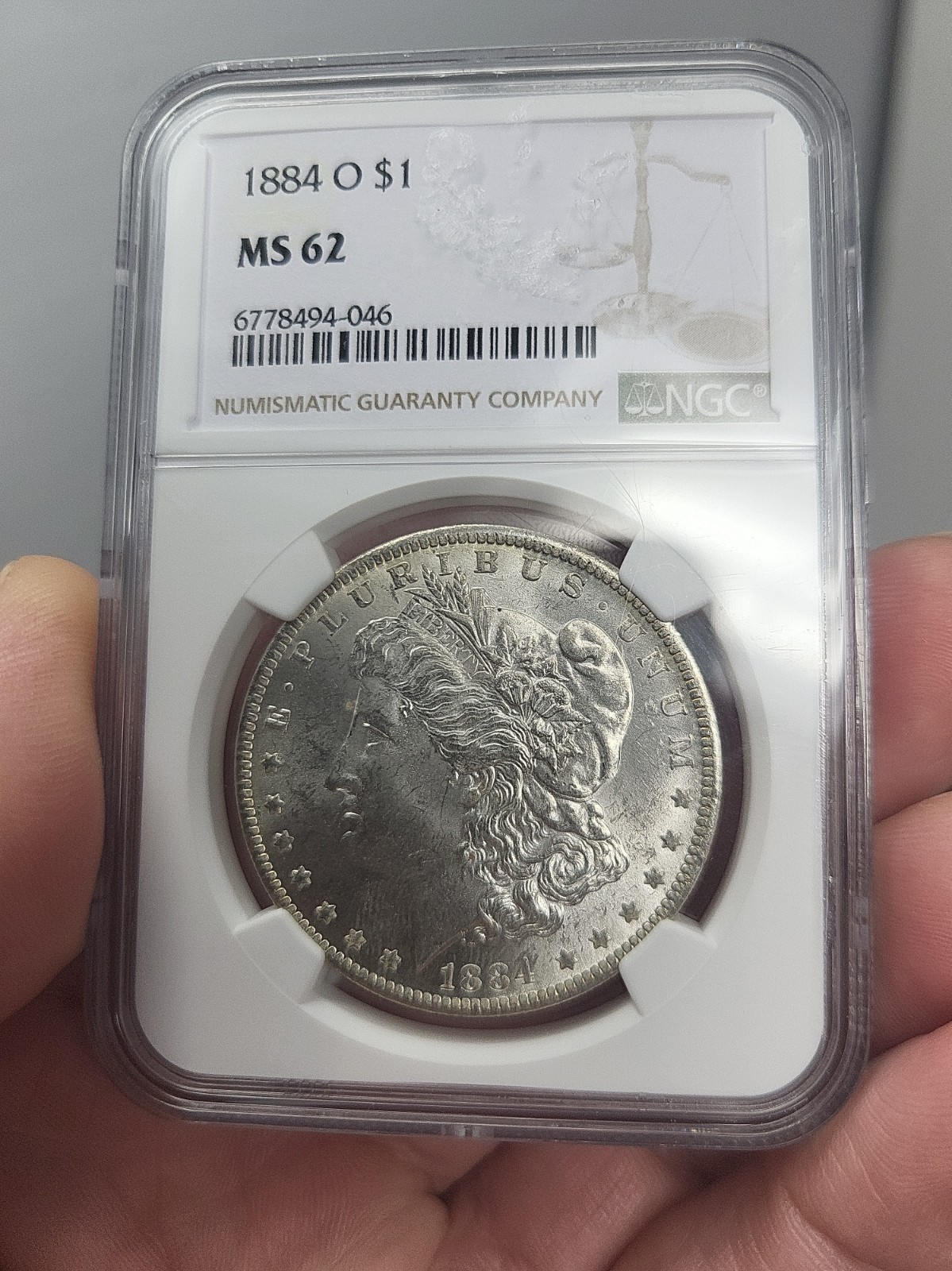 1884-O Morgan Silver Dollar NGC MS62 Justice Label 1884-O Morgan Silver Dollar NGC MS62 Justice Label