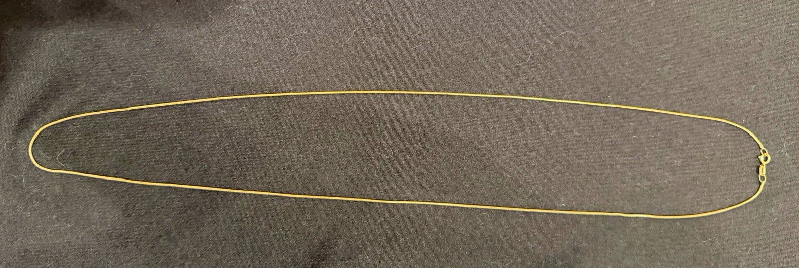 24” Made in Italy 14k gold thin snake chain necklace, lightly worn. 24” Made in Italy 14k gold thin snake chain necklace, lightly worn.