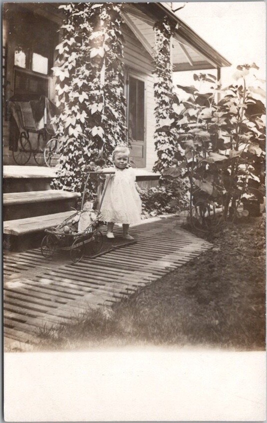 c1910s RPPC Real Photo Postcard Baby Girl with DOLL in Stroller / House Porch