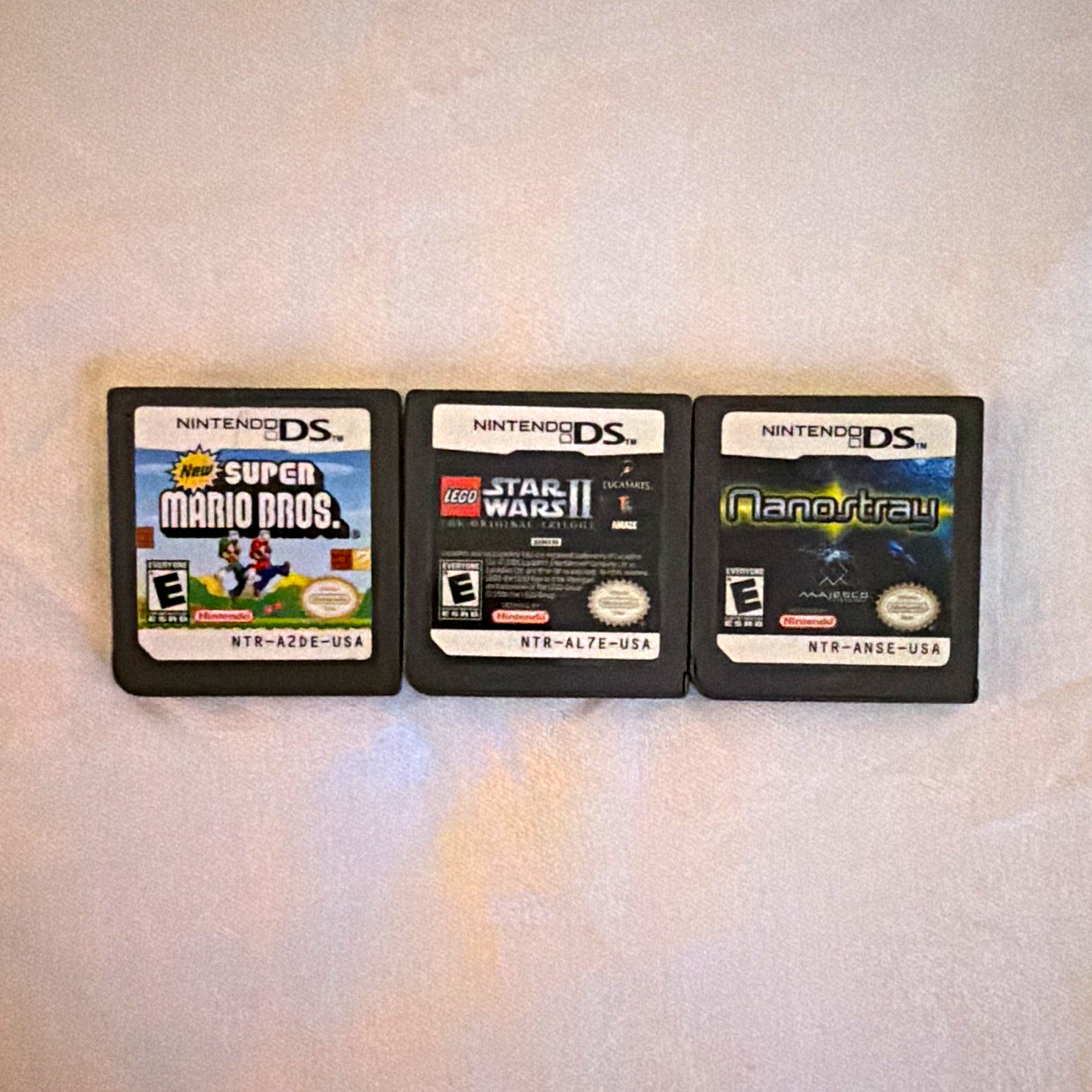 Nintendo DS Lot of 3 Games: New Super Mario Bros, LEGO Star Wars, Nanostray Nintendo DS Lot of 3 Games: New Super Mario Bros, LEGO Star Wars, Nanostray