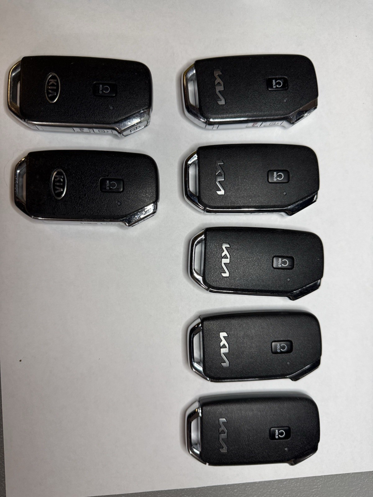 OEM Used Kia Smart Keys Lot of 7 4-Button Locked Mixed Cut Blades Locksmith