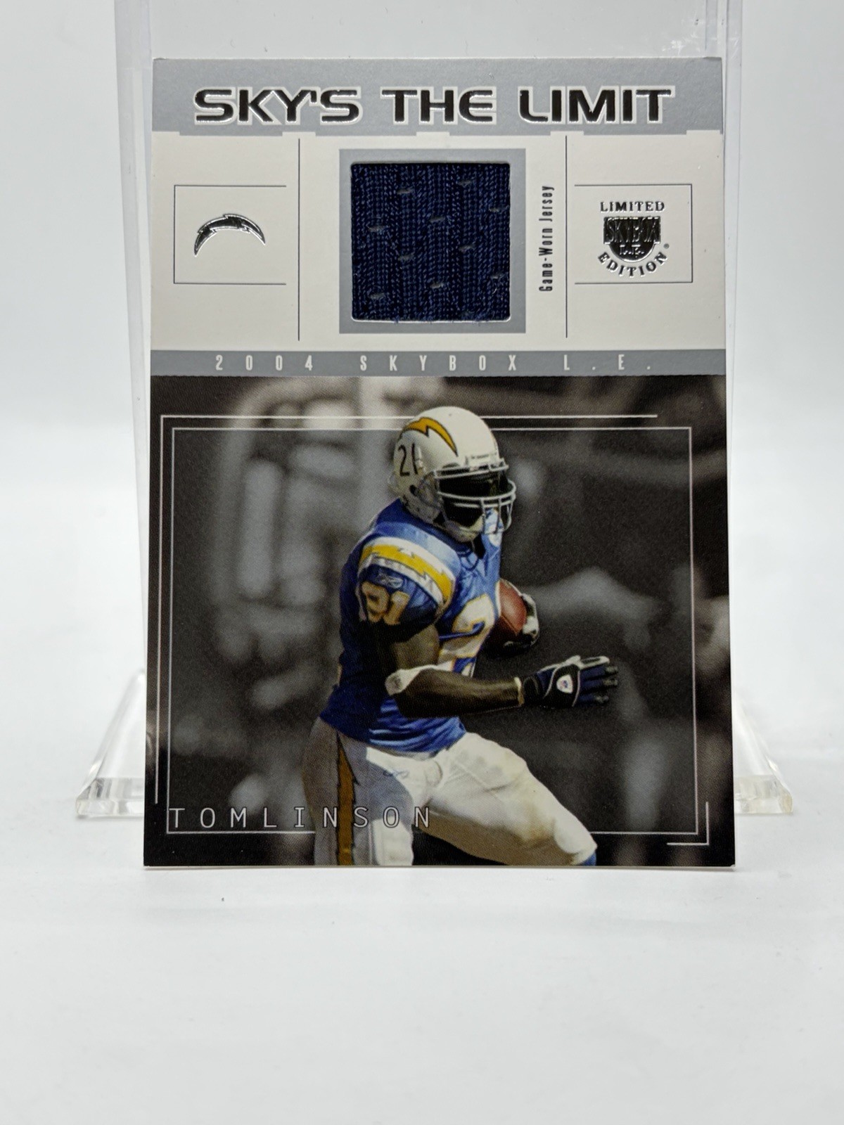 2004 Fleer/Skybox Sky\'s The Limit RELIC #SL-LT LADAINIAN TOMLINSON (#\'d / 99)
