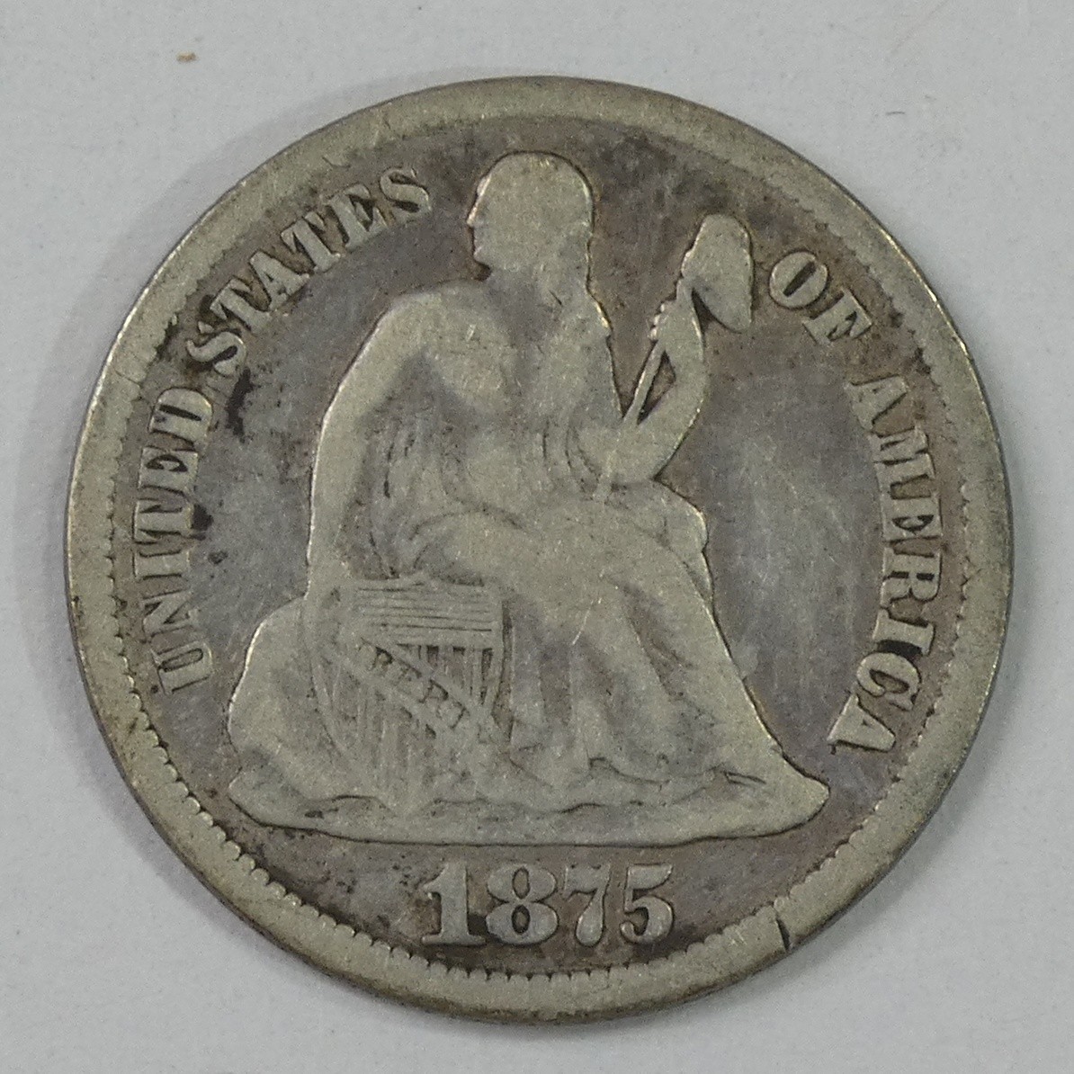 1875-CC Seated Liberty Carson City Silver Dime Mintmark Above Bow VERY GOOD