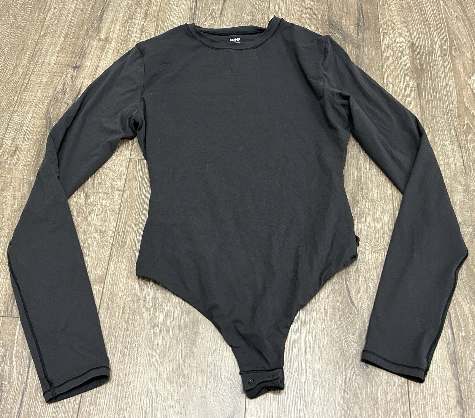 Skims Black Long Sleeve Crew Neck Bodysuit Stretch Snap Closure Size M Skims Black Long Sleeve Crew Neck Bodysuit Stretch Snap Closure Size M