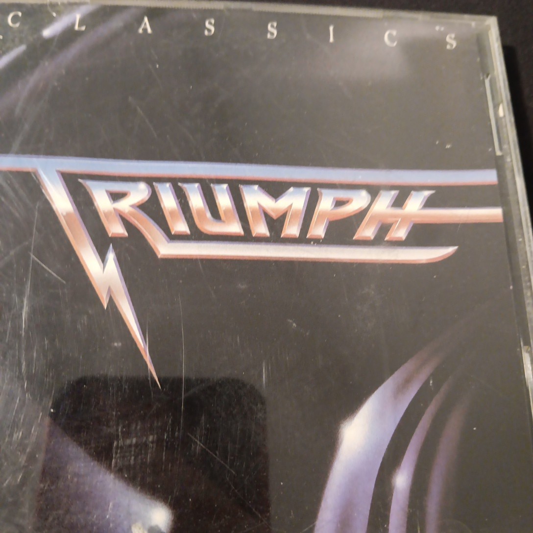 TRIUMPH Classics CD “LIKE NEW”BRAND NEW CASE Polished 