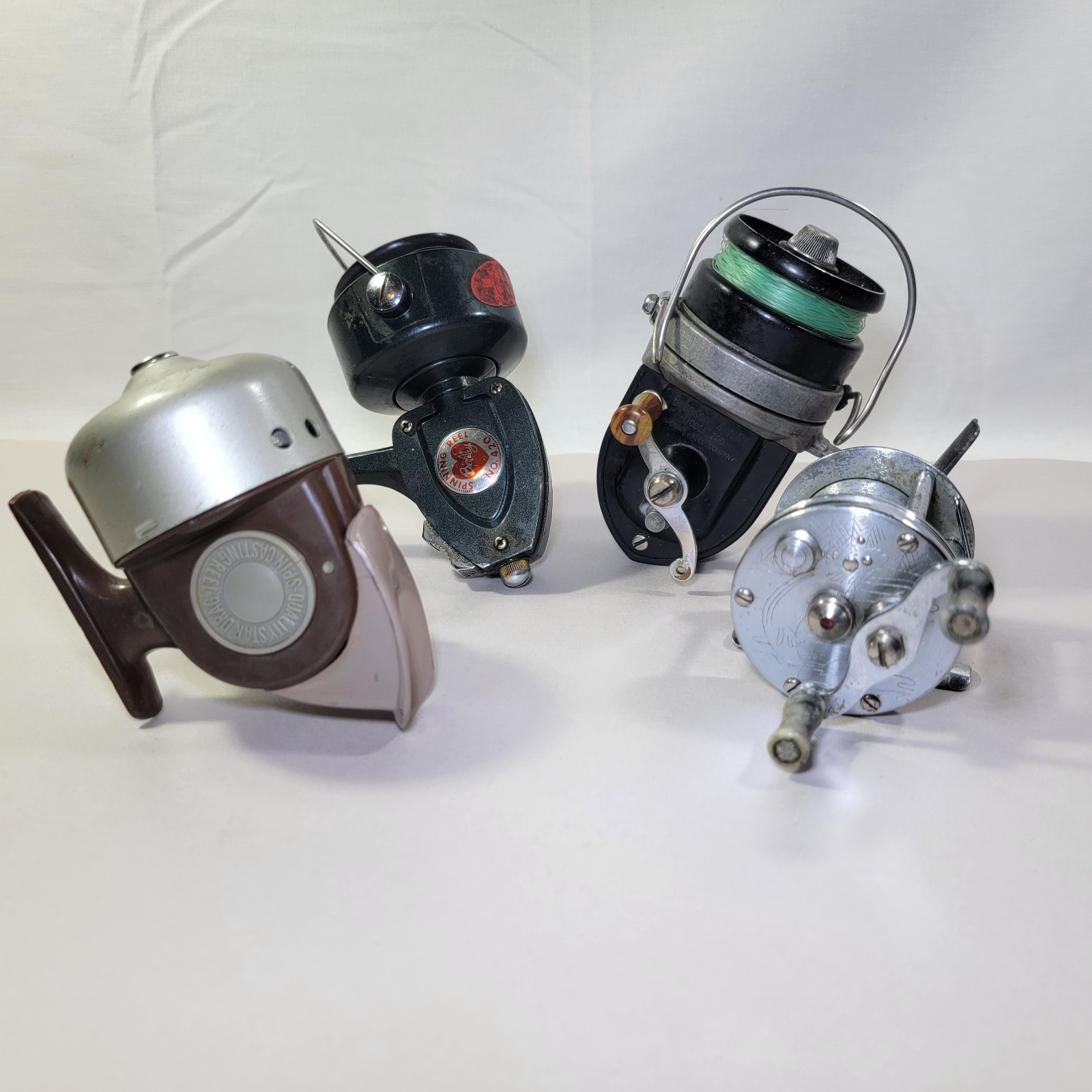 Vintage Fishing Reel Lot Of 4 Bronson 4-Way, Berkley 420 Quality Star Engraved + Vintage Fishing Reel Lot Of 4 Bronson 4-Way, Berkley 420 Quality Star Engraved +