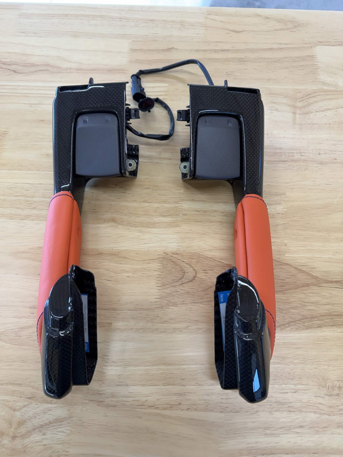 OEM FERRARI F8 Carbon Fiber Interior Door Handles, with orange/blue trim OEM FERRARI F8 Carbon Fiber Interior Door Handles, with orange/blue trim